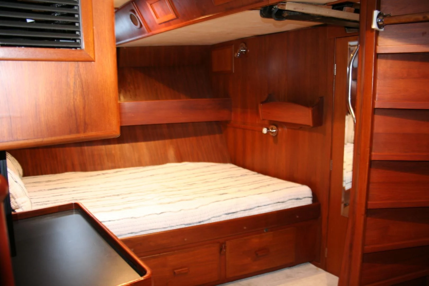 a room with wooden furniture aboard SINDBAD Yacht for Sale