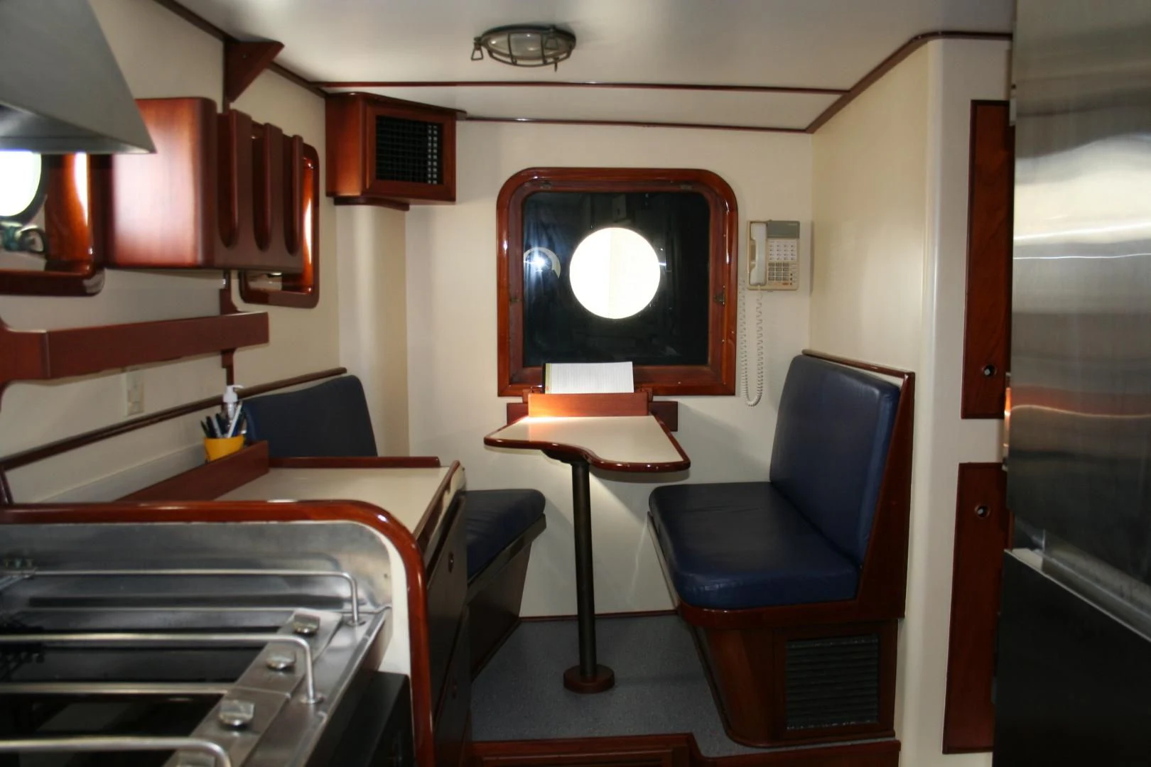 a room with a bed and a desk aboard SINDBAD Yacht for Sale