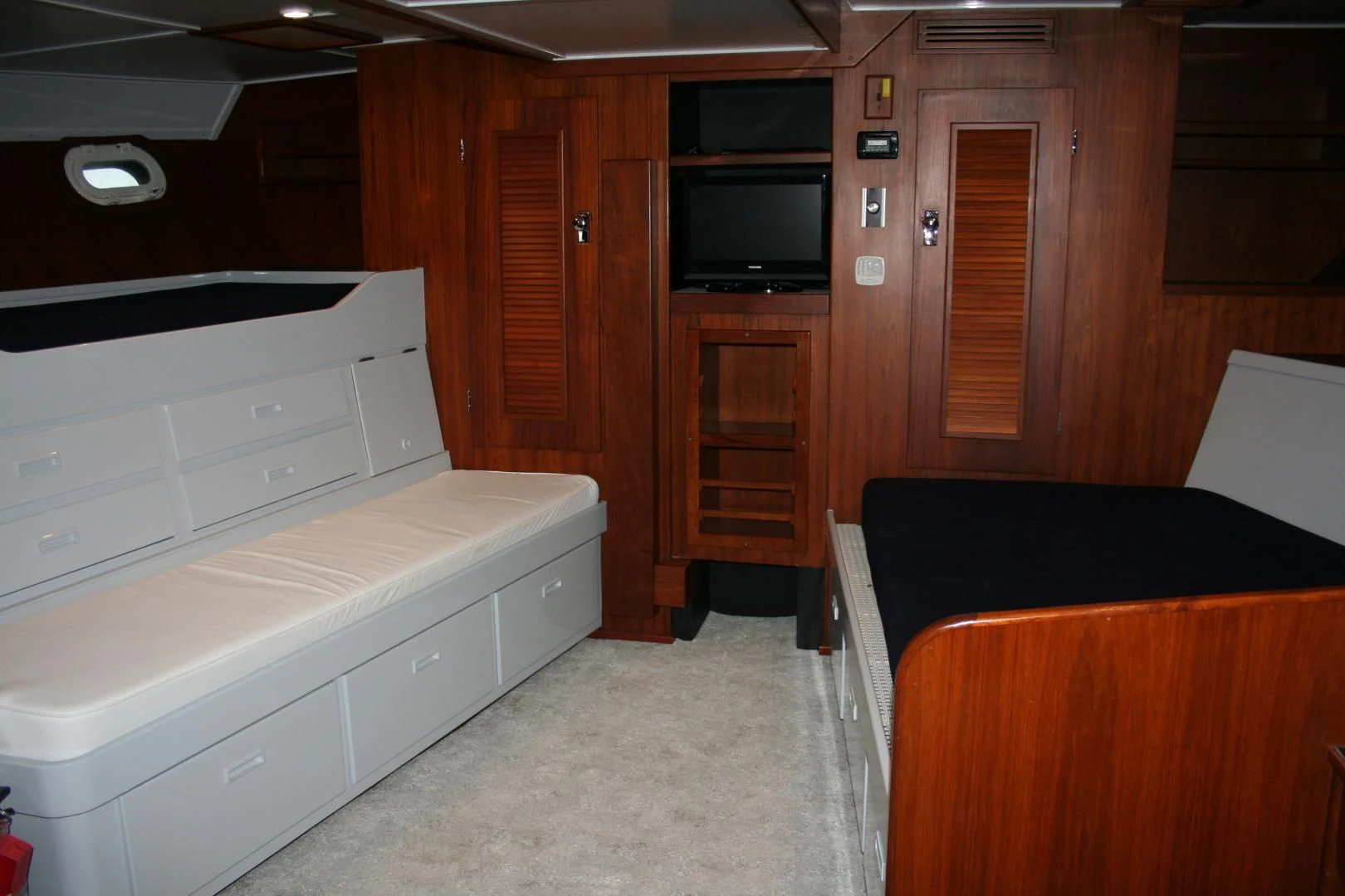 a room with a bed and a tv aboard SINDBAD Yacht for Sale