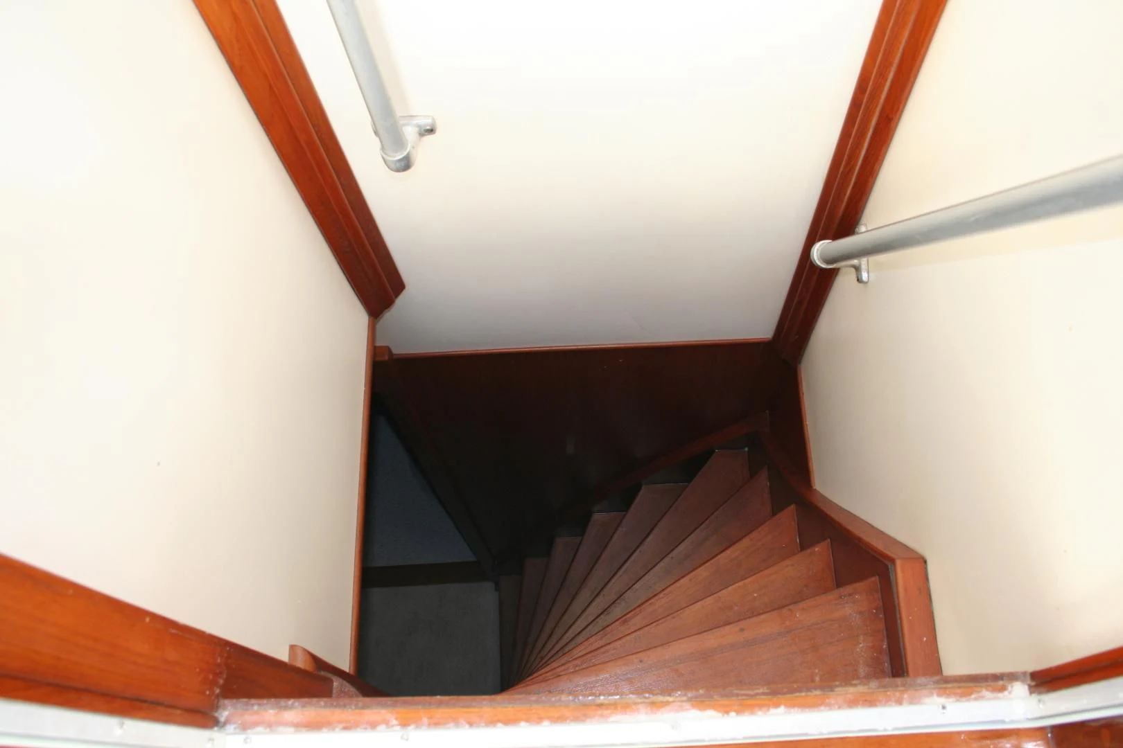 a wooden staircase in a house aboard SINDBAD Yacht for Sale