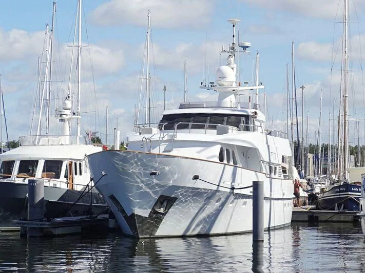 a couple of boats are parked in the water aboard SUAKIN Yacht for Sale