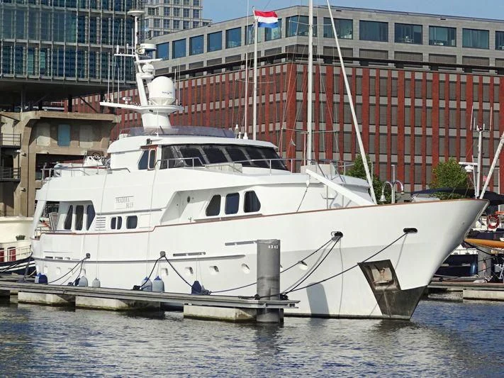 a white boat docked aboard SUAKIN Yacht for Sale