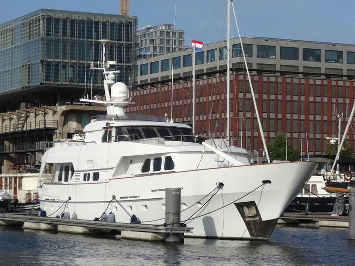 a boat docked in a harbor aboard SUAKIN Yacht for Sale