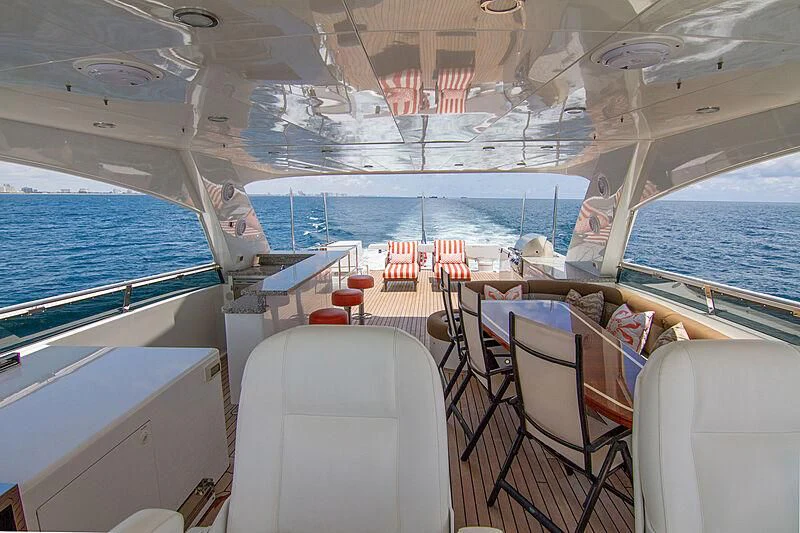 a boat with a deck and chairs aboard SAMARITANA Yacht for Sale