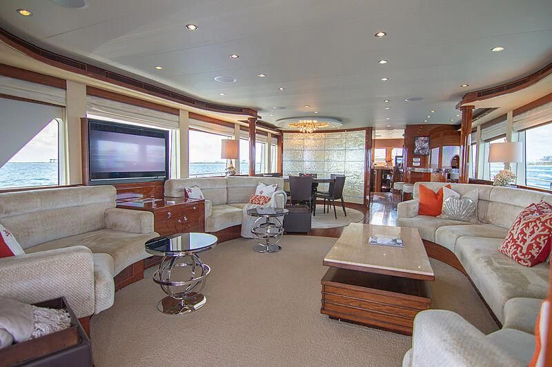 a living room with a large screen aboard SAMARITANA Yacht for Sale
