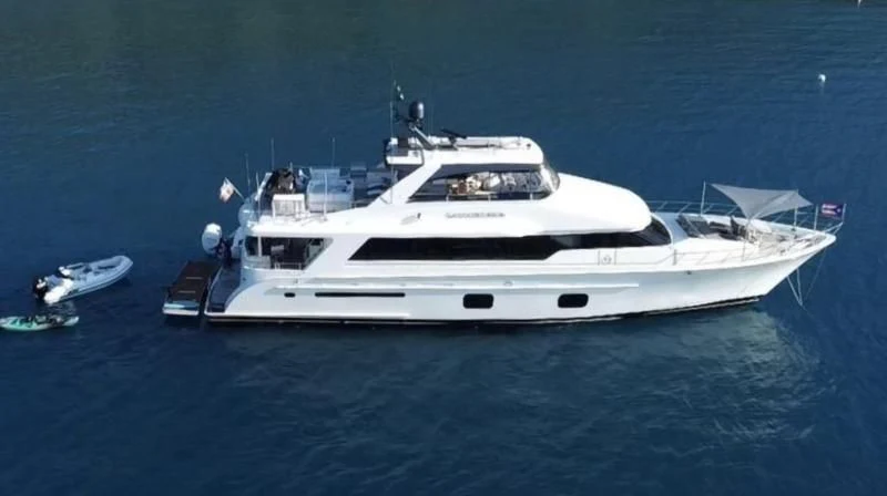 a white yacht in the ocean aboard SAMARITANA Yacht for Sale