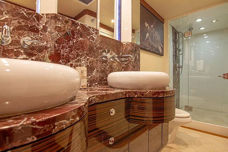 a bathroom with a large mirror aboard SAMARITANA Yacht for Sale