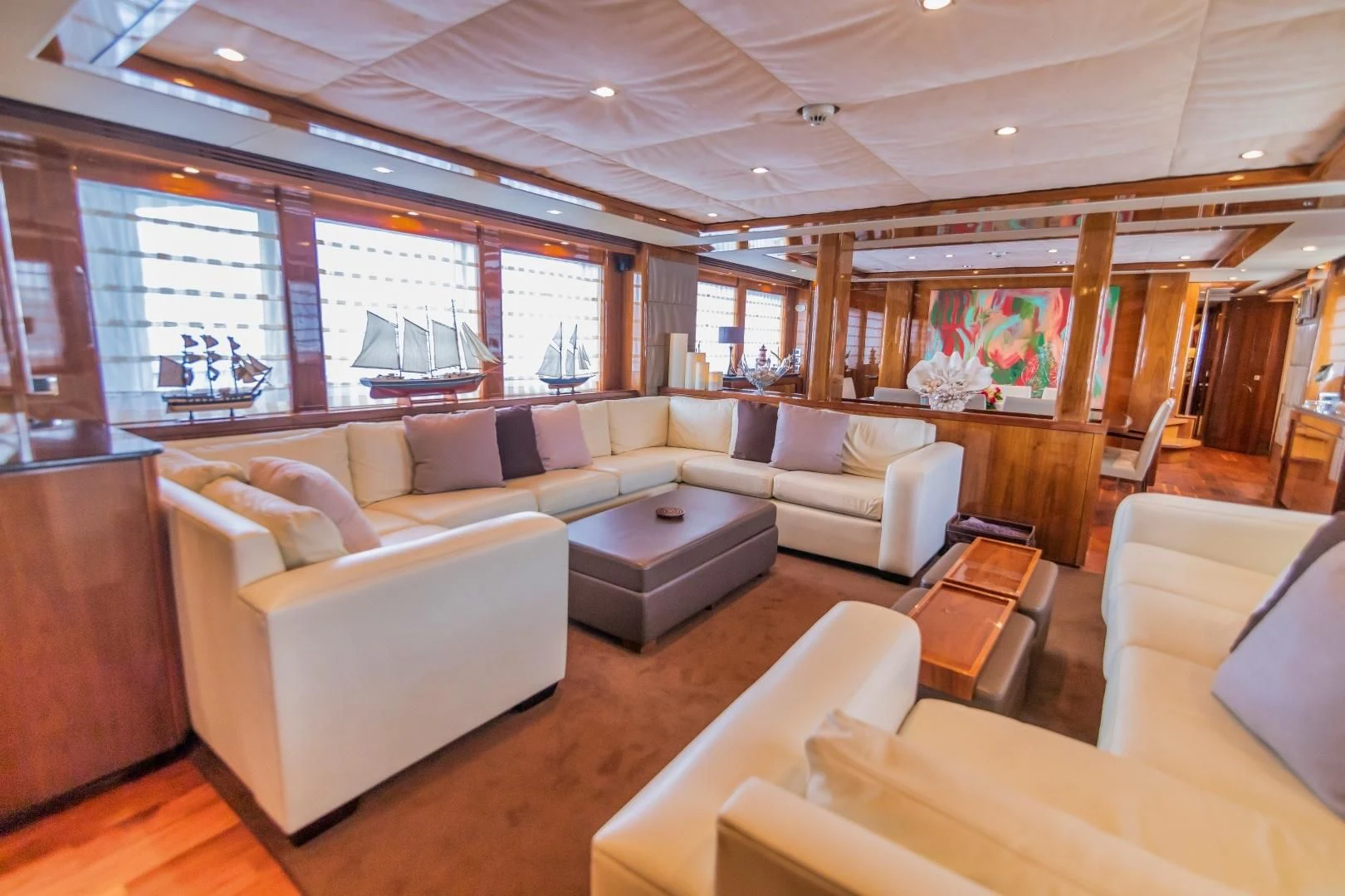 a large living room with a large window aboard VIVA LA VIDA Yacht for Sale