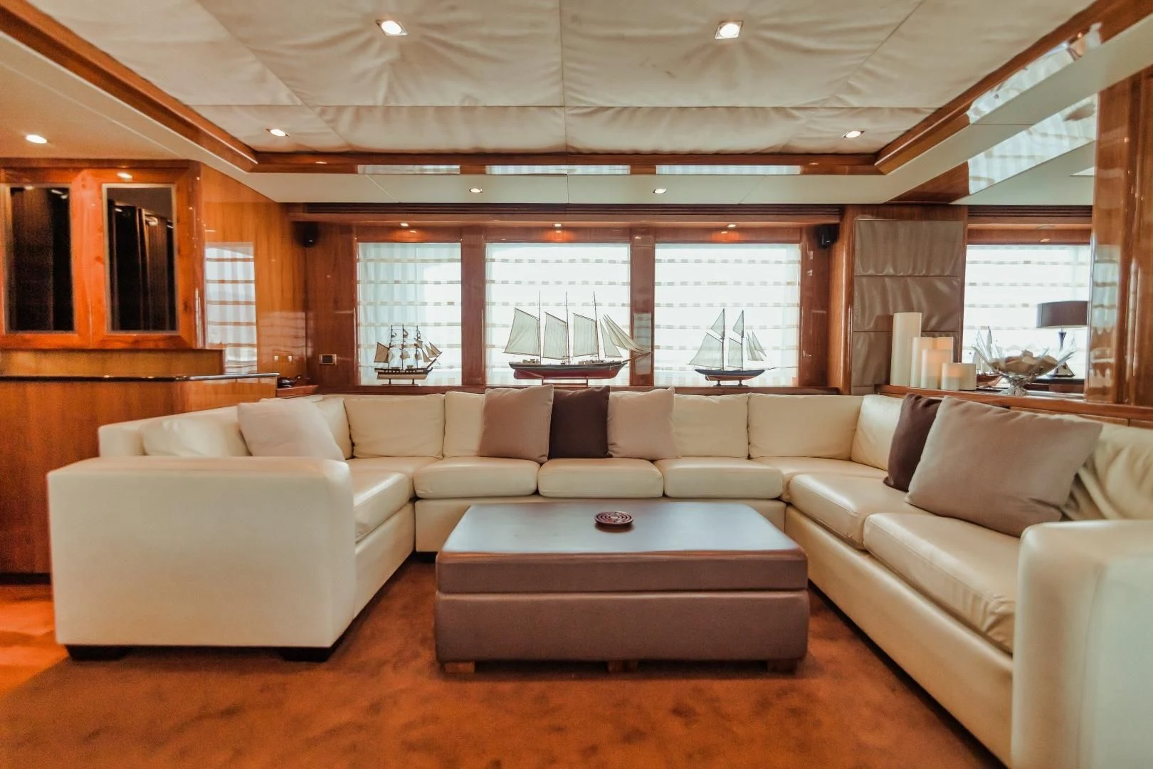 a living room with a couch and a table aboard VIVA LA VIDA Yacht for Sale