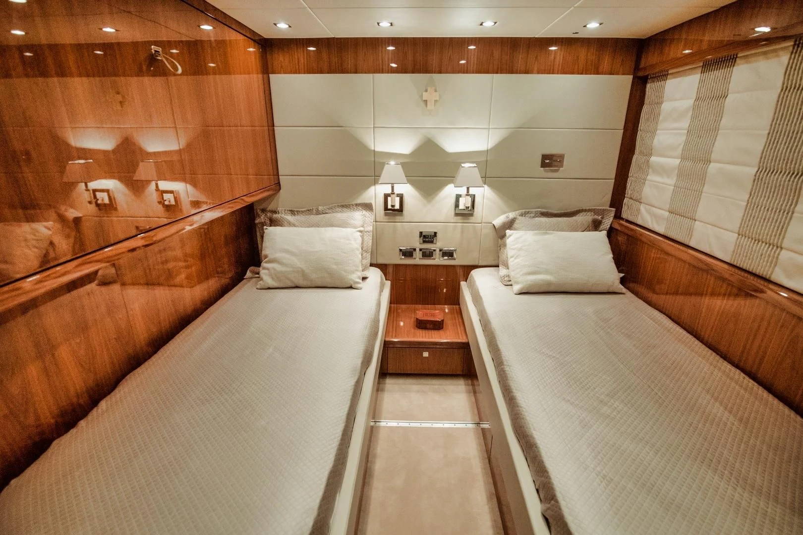 a room with a bed and a table aboard VIVA LA VIDA Yacht for Sale