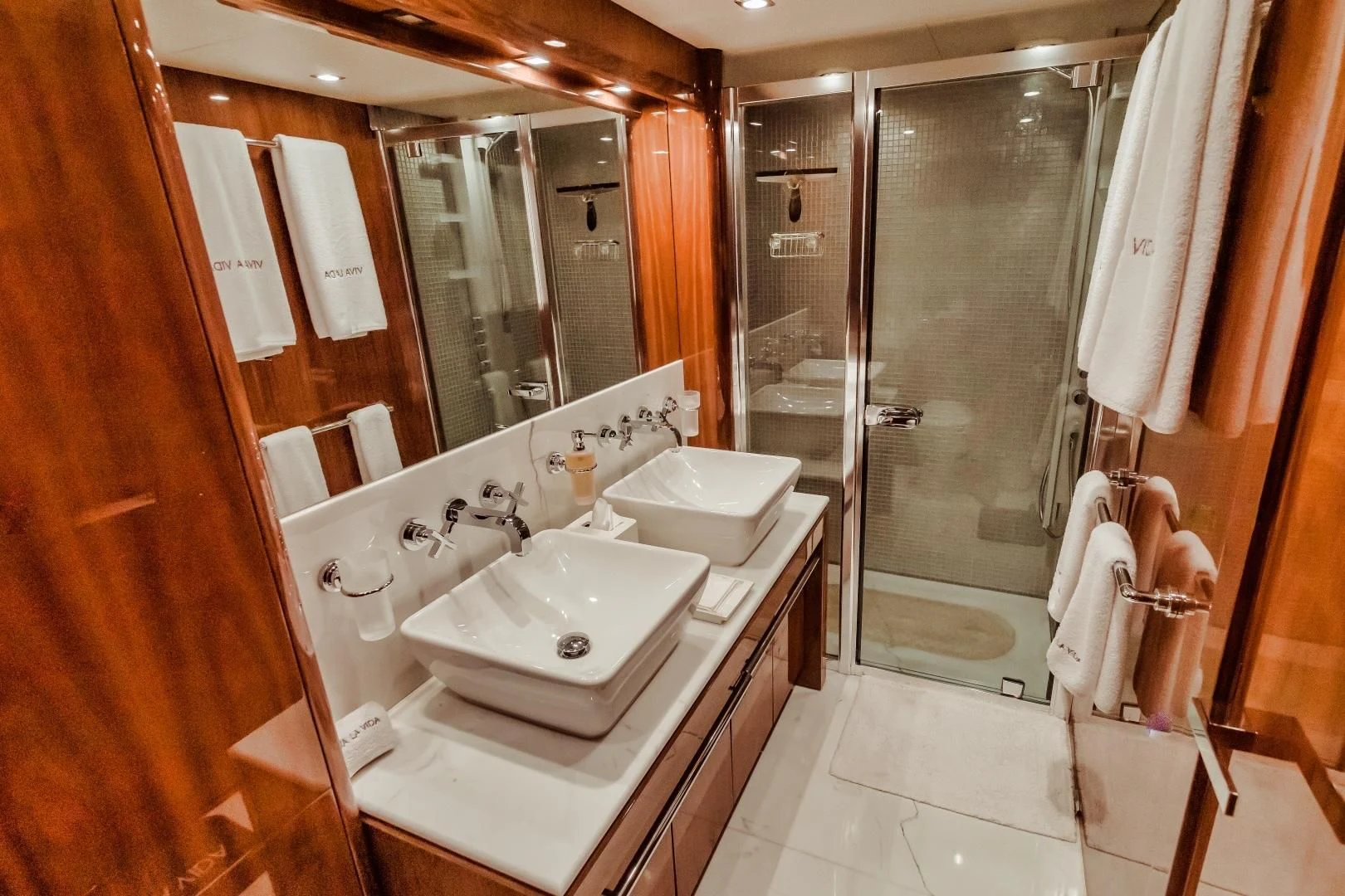 a bathroom with a large mirror aboard VIVA LA VIDA Yacht for Sale