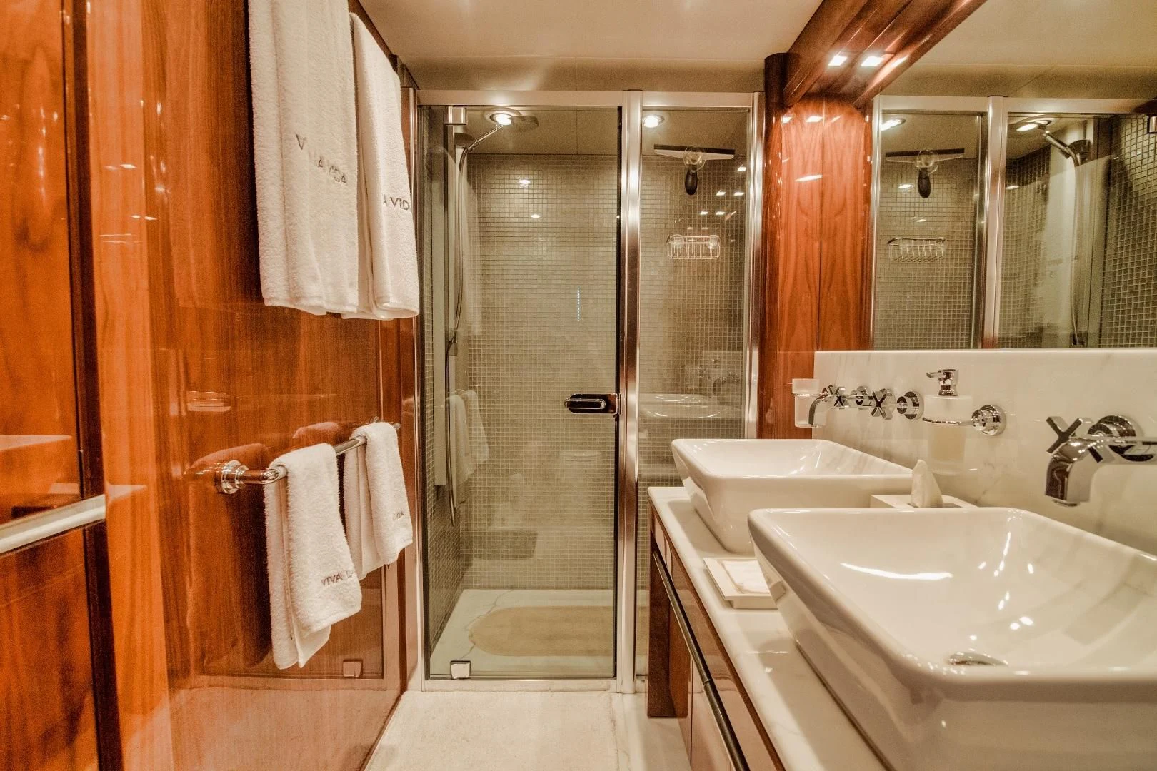 a bathroom with a glass shower aboard VIVA LA VIDA Yacht for Sale