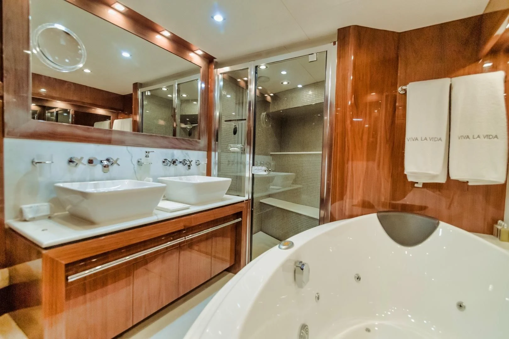 a bathroom with a large mirror aboard VIVA LA VIDA Yacht for Sale
