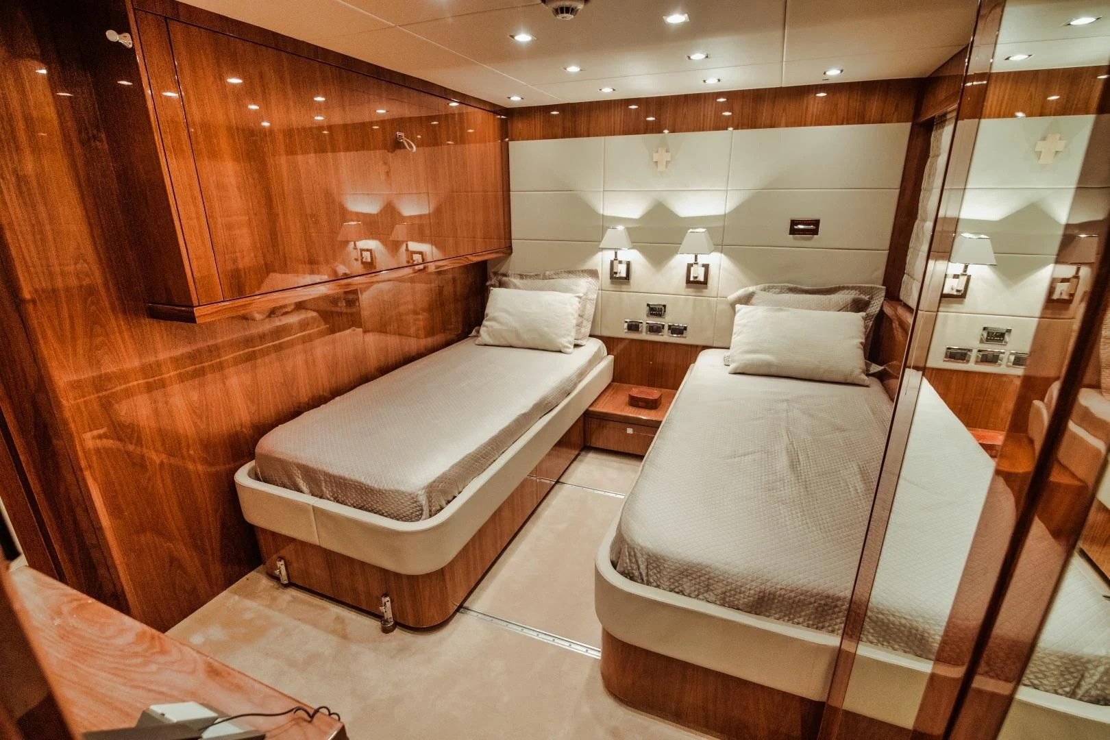 a room with a bed and a mirror aboard VIVA LA VIDA Yacht for Sale