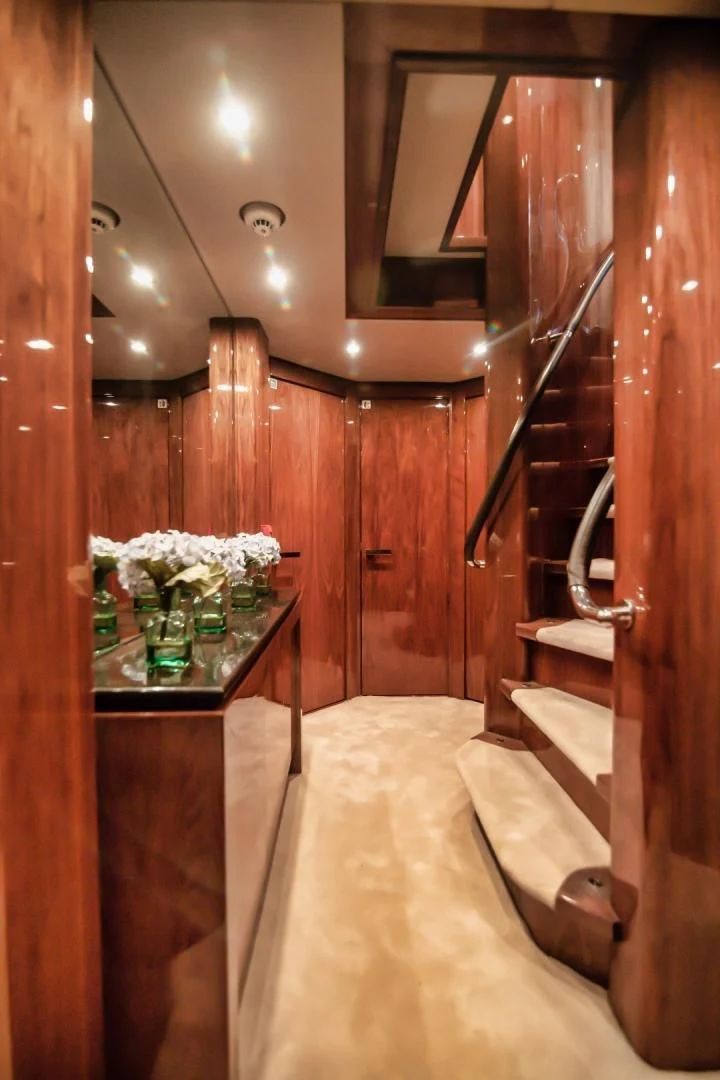 a wooden bathroom with a large wooden closet aboard VIVA LA VIDA Yacht for Sale