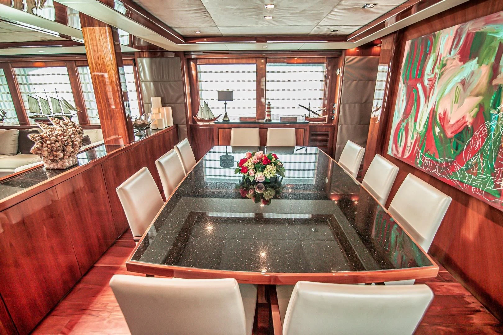 a room with a large table and chairs aboard VIVA LA VIDA Yacht for Sale