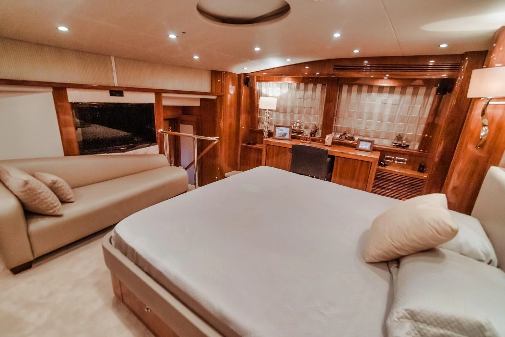 a room with a bed and a couch aboard VIVA LA VIDA Yacht for Sale