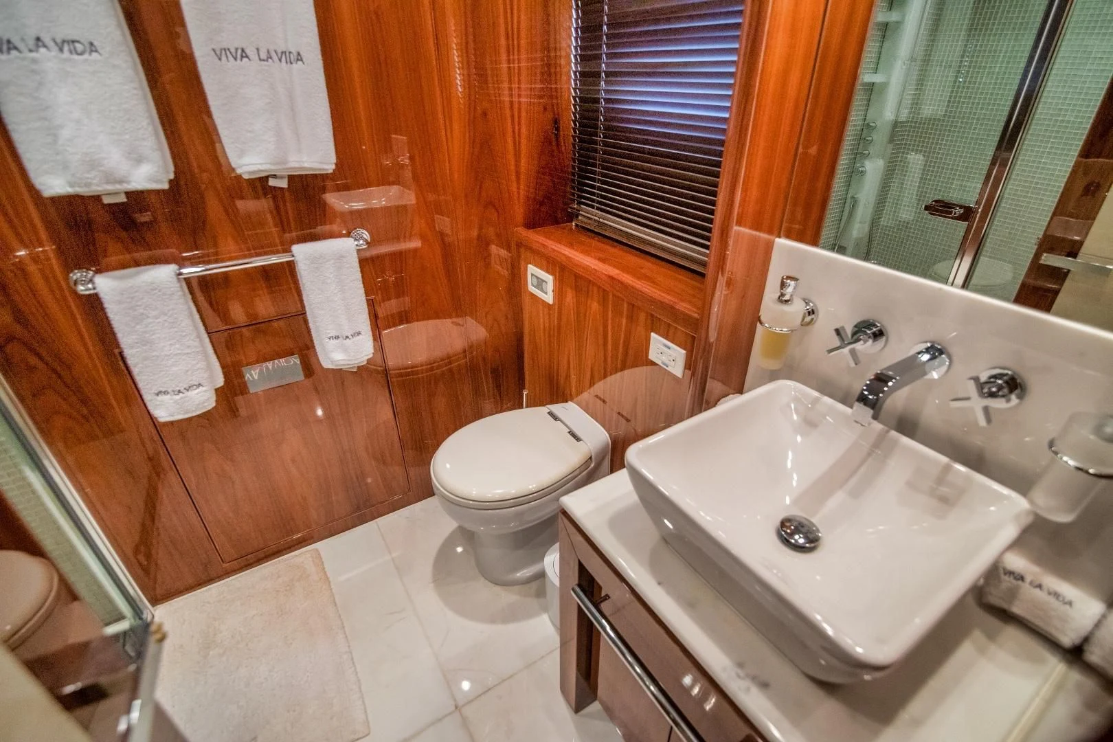 a bathroom with a sink toilet and a shower aboard VIVA LA VIDA Yacht for Sale