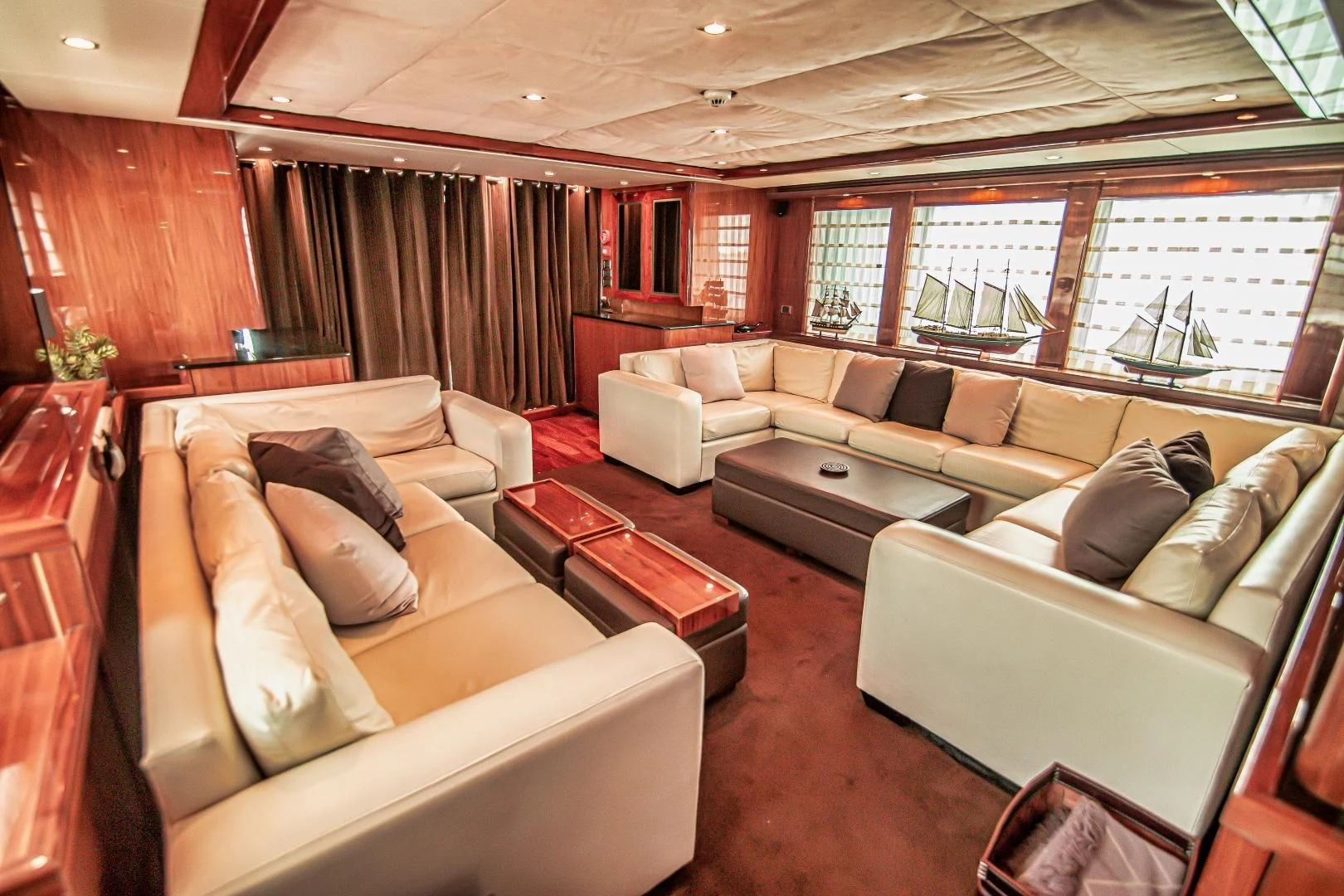 a living room with a couch and a table aboard VIVA LA VIDA Yacht for Sale