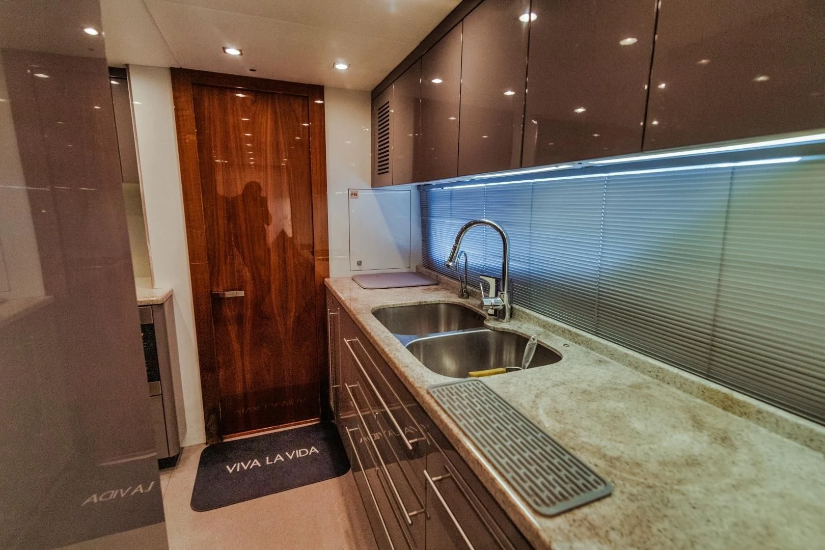 a kitchen with a sink and a counter aboard VIVA LA VIDA Yacht for Sale
