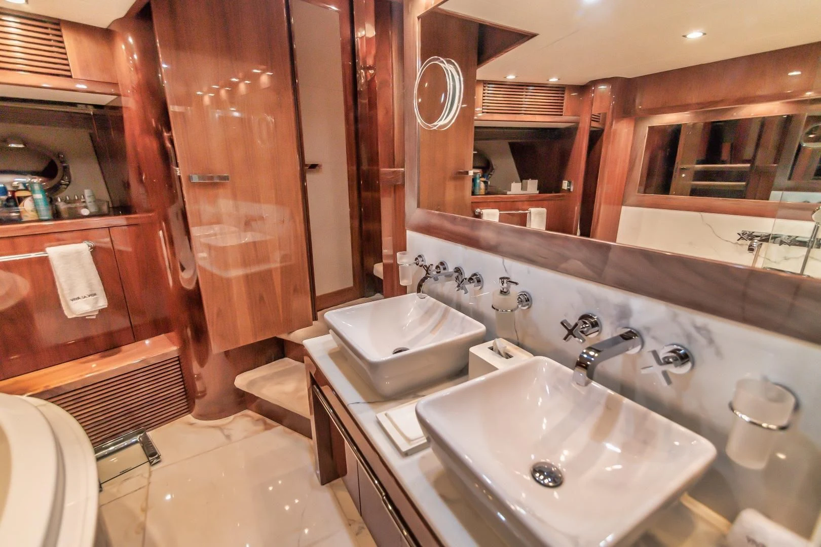 a bathroom with a sink and a mirror aboard VIVA LA VIDA Yacht for Sale