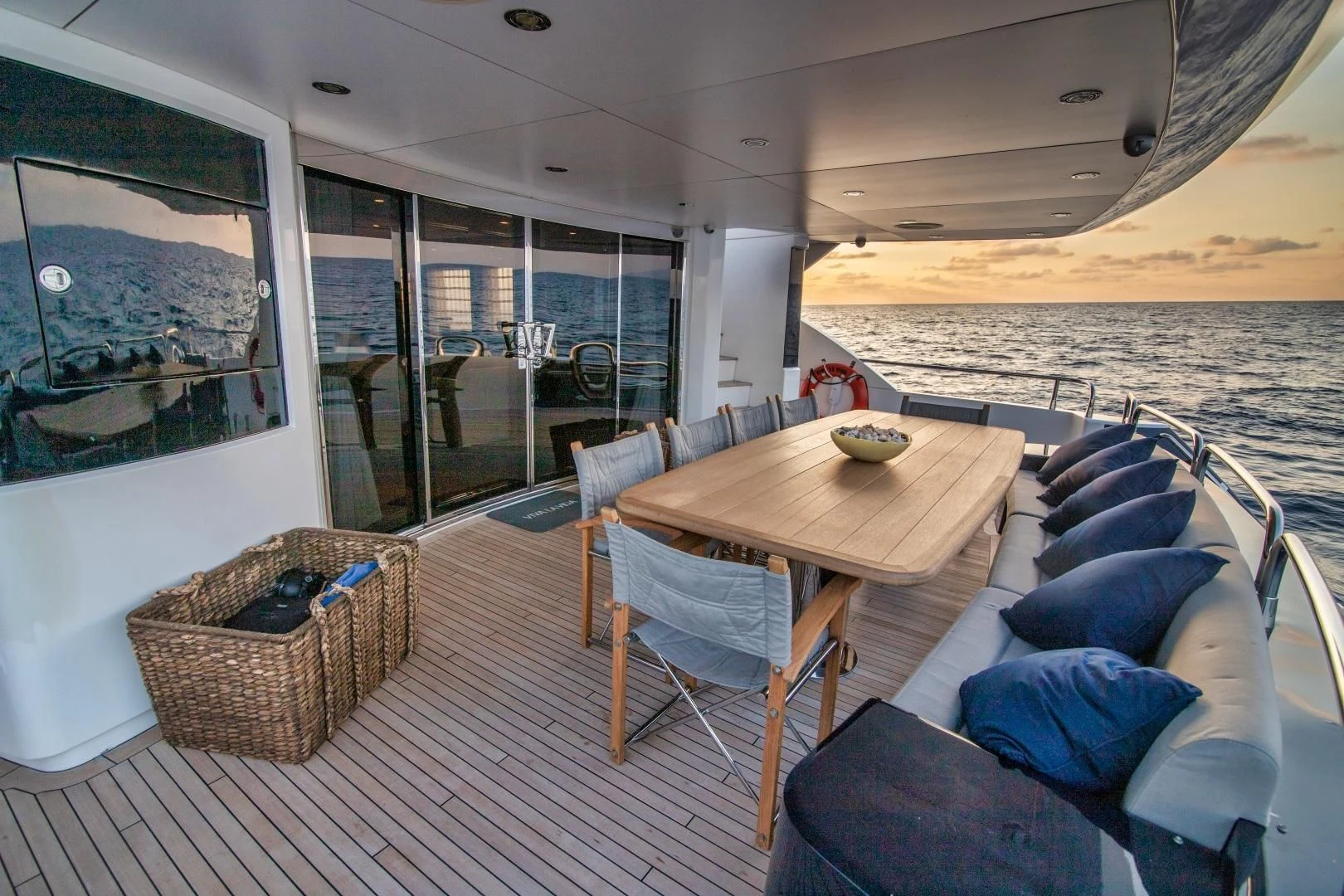 a table and chairs on a deck aboard VIVA LA VIDA Yacht for Sale