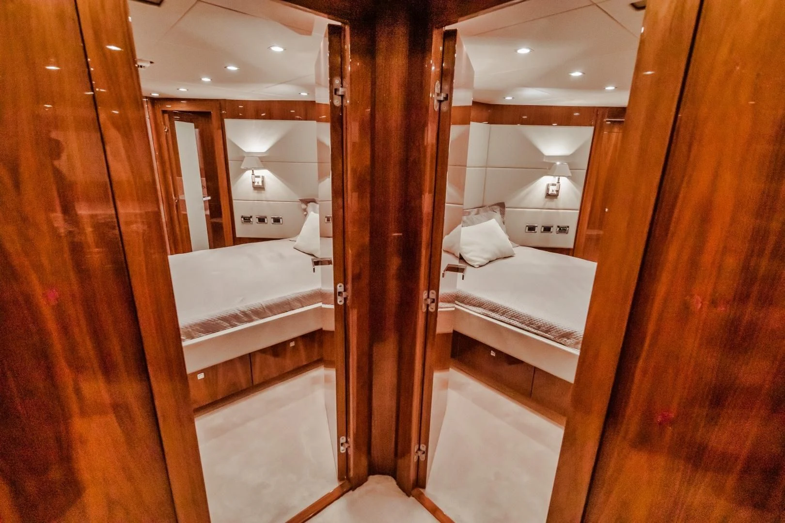 a bathroom with a wood door aboard VIVA LA VIDA Yacht for Sale