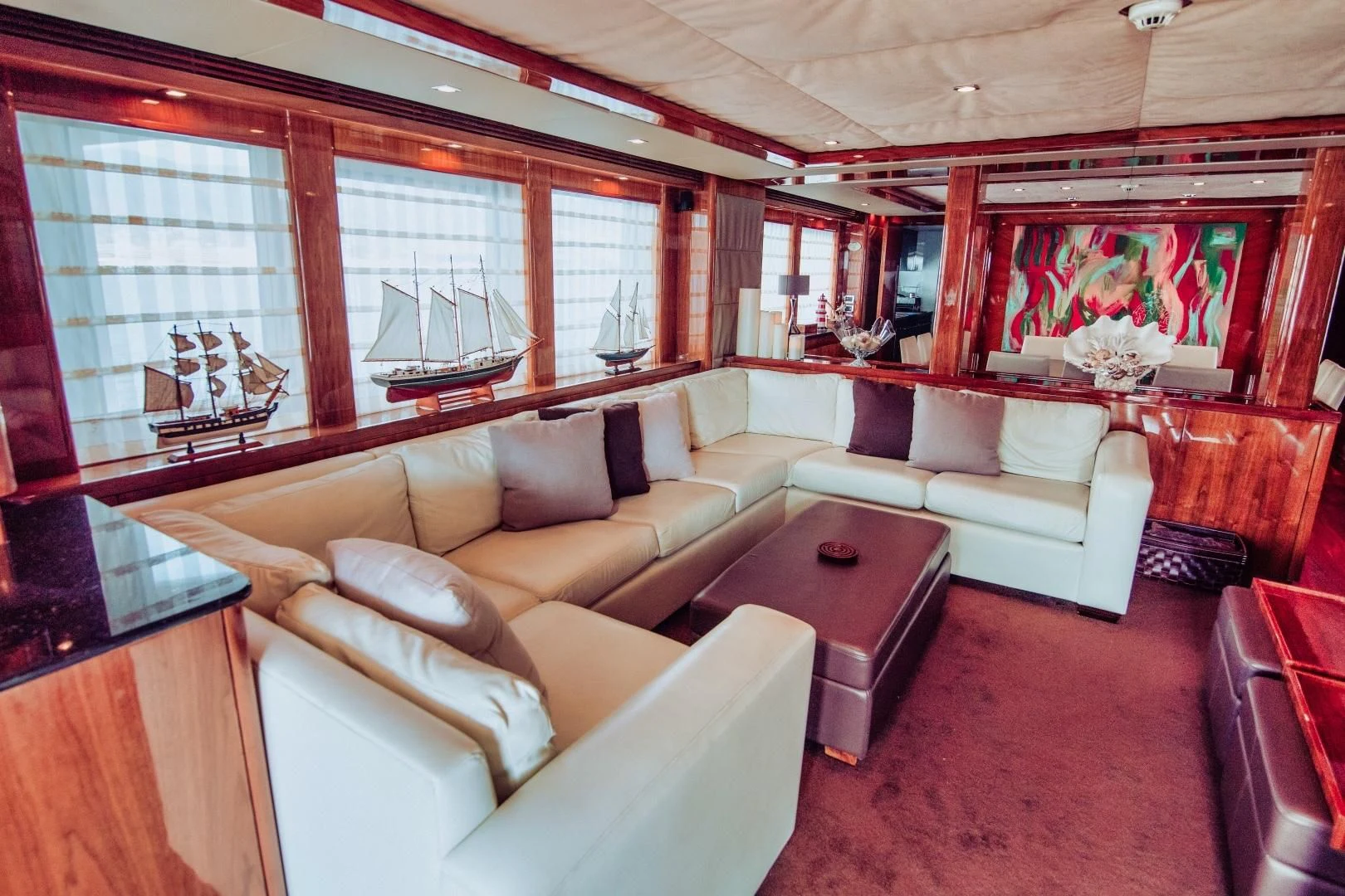 a living room with a couch and a table aboard VIVA LA VIDA Yacht for Sale