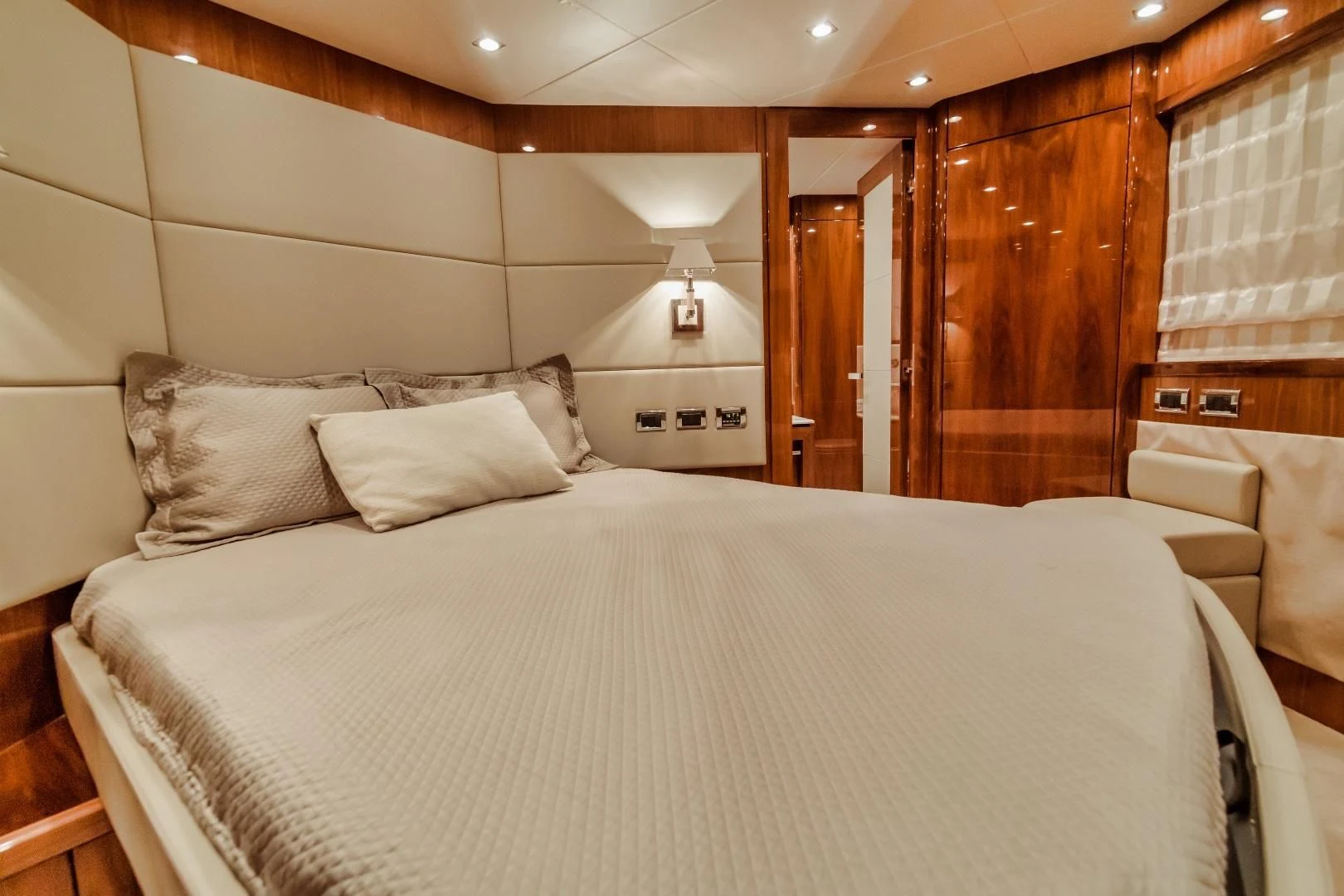 a bed with white sheets aboard VIVA LA VIDA Yacht for Sale