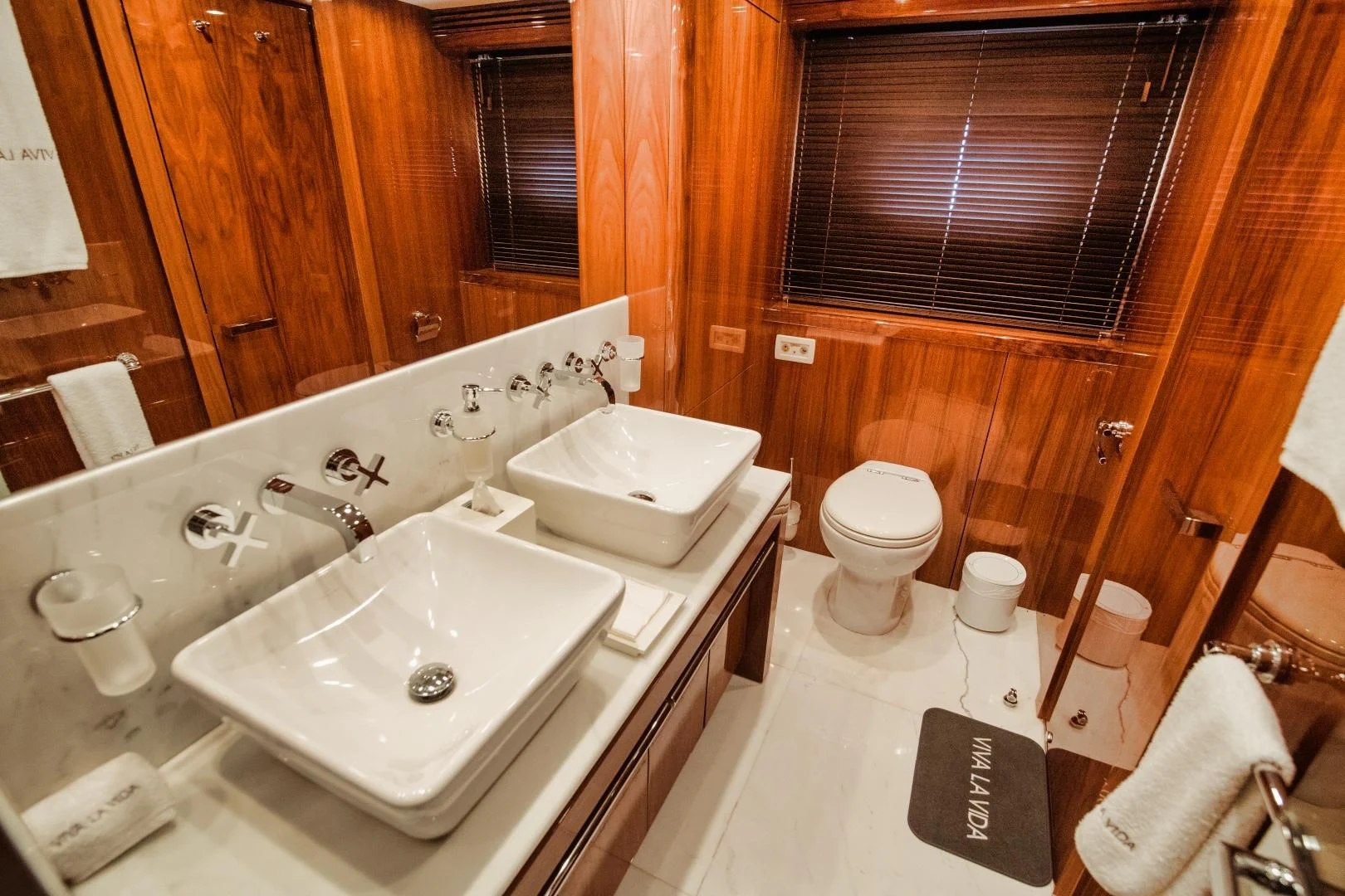 a bathroom with a sink toilet and bathtub aboard VIVA LA VIDA Yacht for Sale