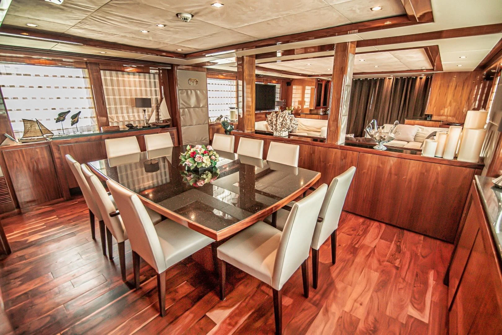 a large room with a table and chairs aboard VIVA LA VIDA Yacht for Sale