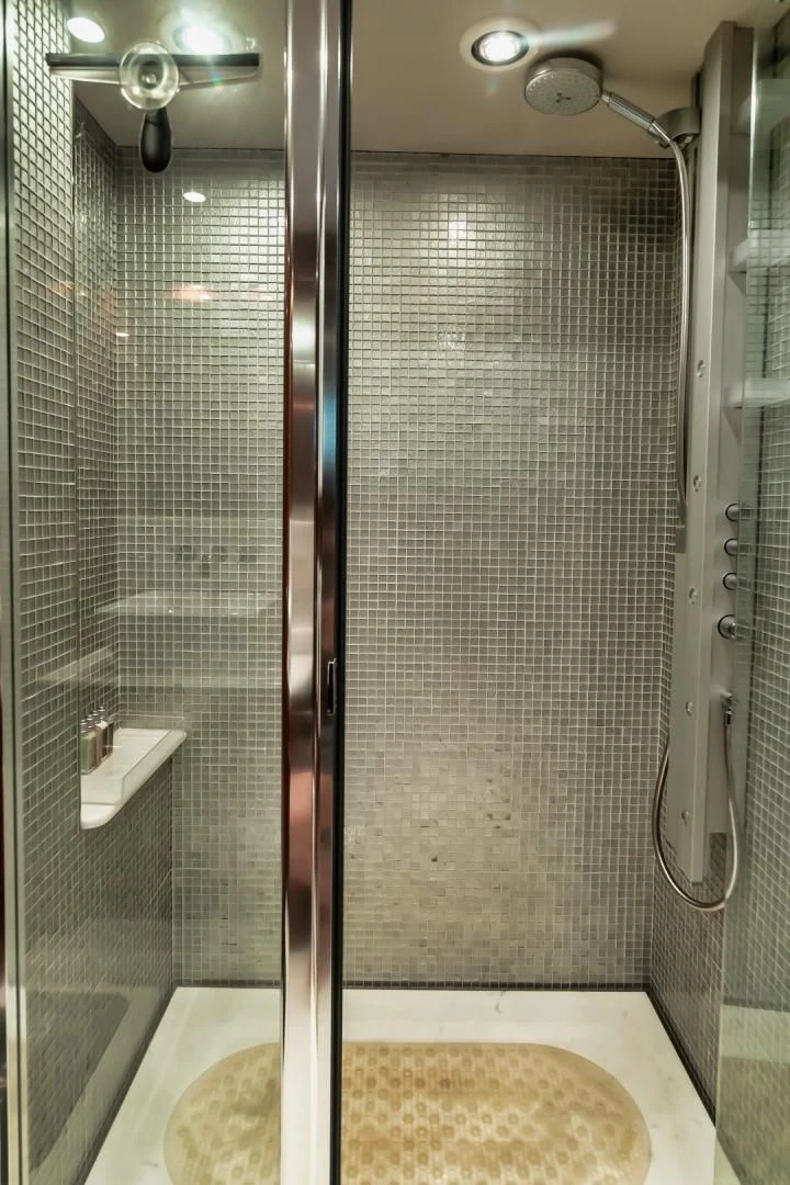 a shower with a glass door aboard VIVA LA VIDA Yacht for Sale