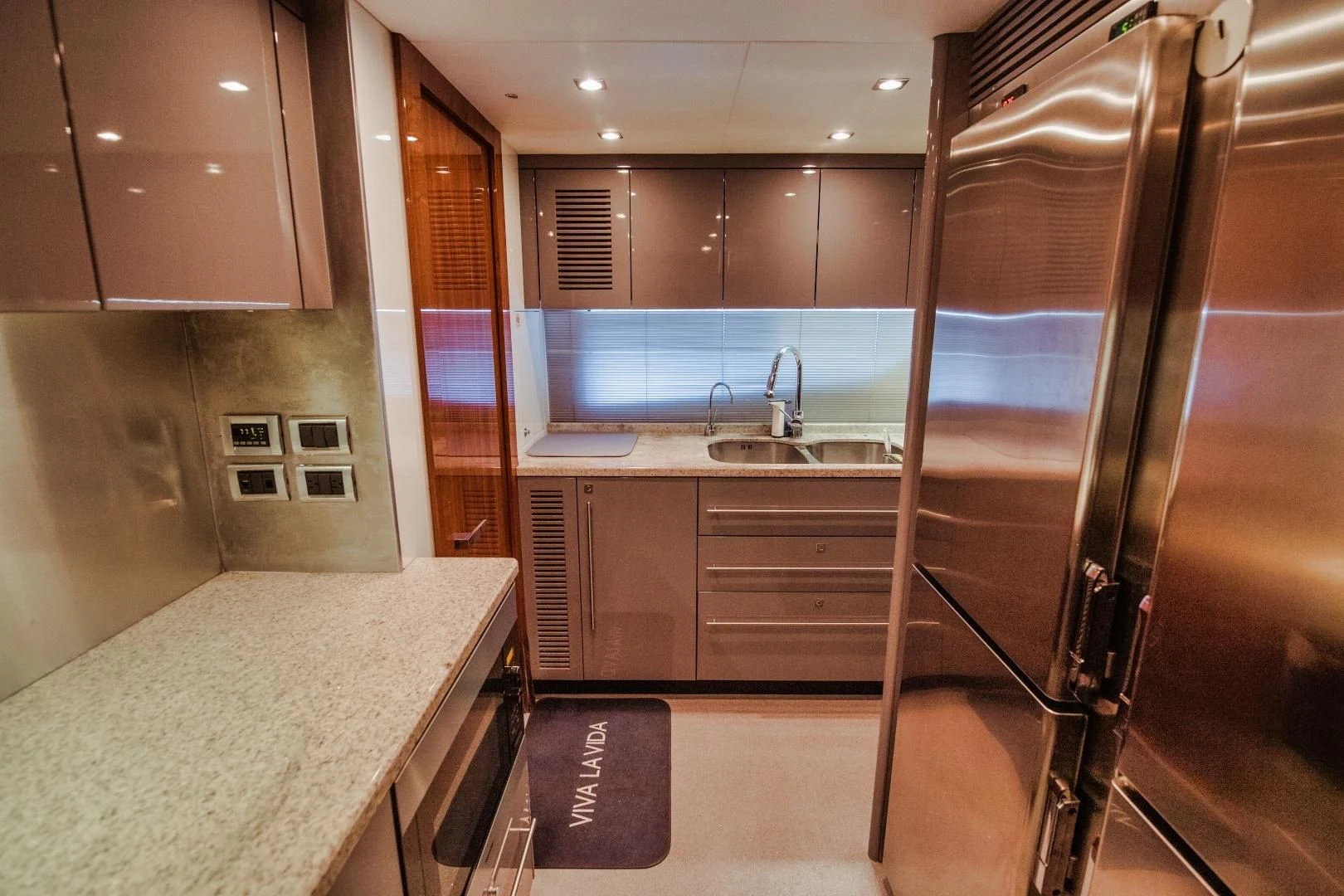 a kitchen with a shower unit and sink aboard VIVA LA VIDA Yacht for Sale