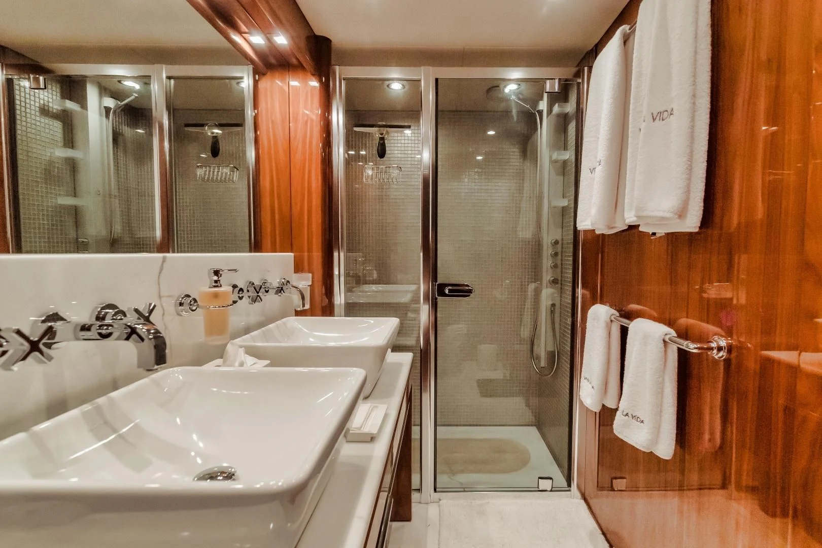 a bathroom with a sink and shower aboard VIVA LA VIDA Yacht for Sale