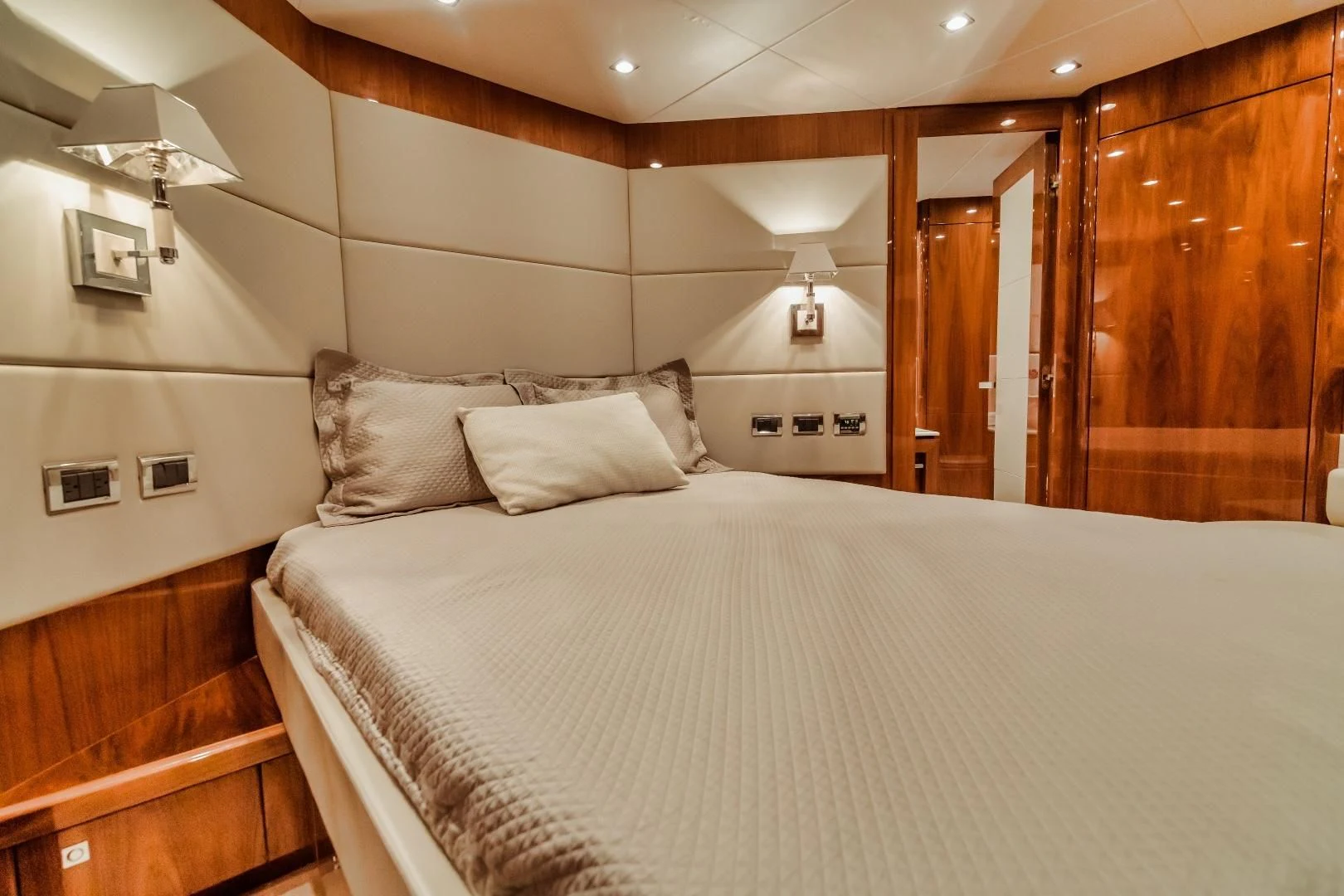 a bed with white sheets aboard VIVA LA VIDA Yacht for Sale
