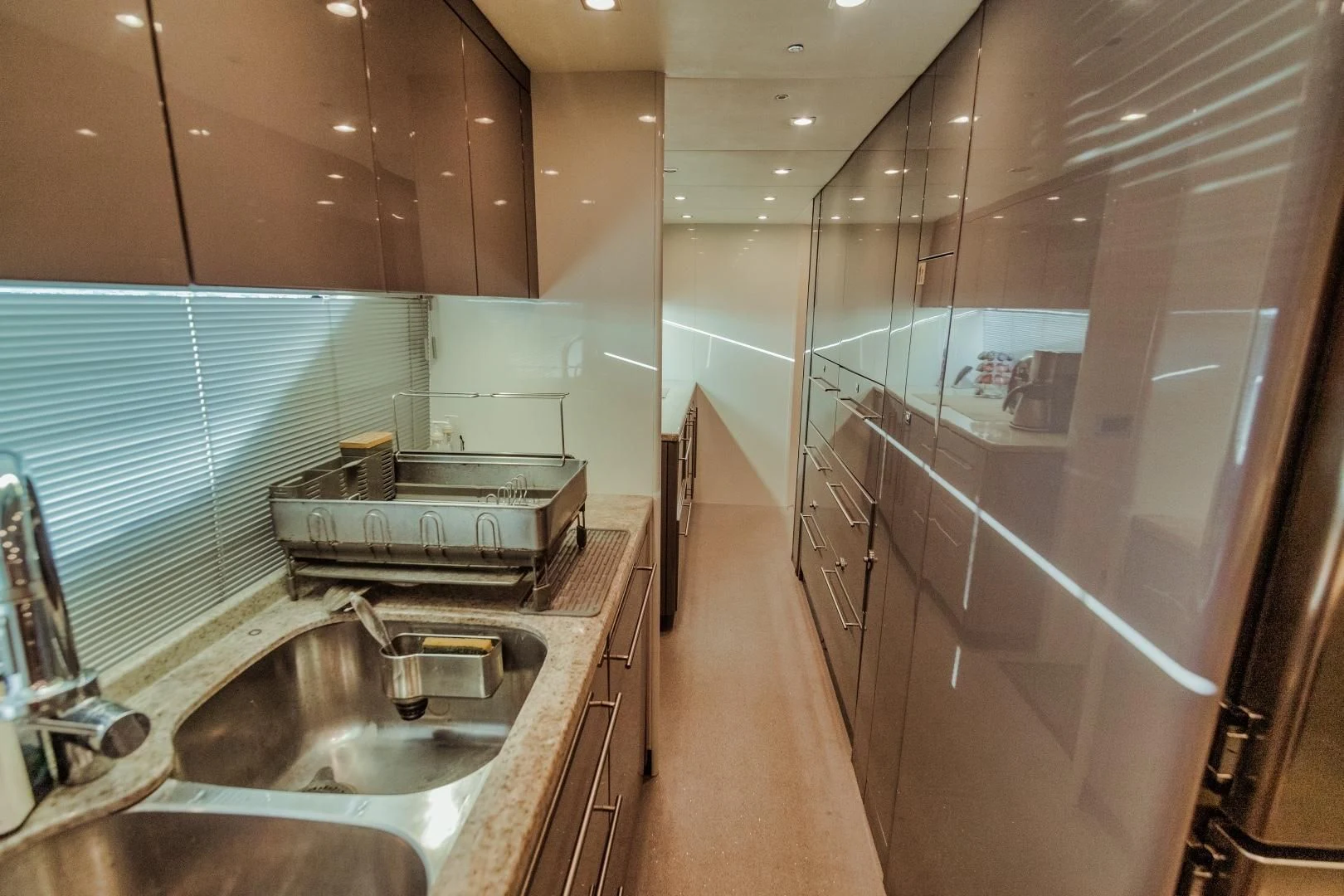 a bathroom with a sink and a large mirror aboard VIVA LA VIDA Yacht for Sale