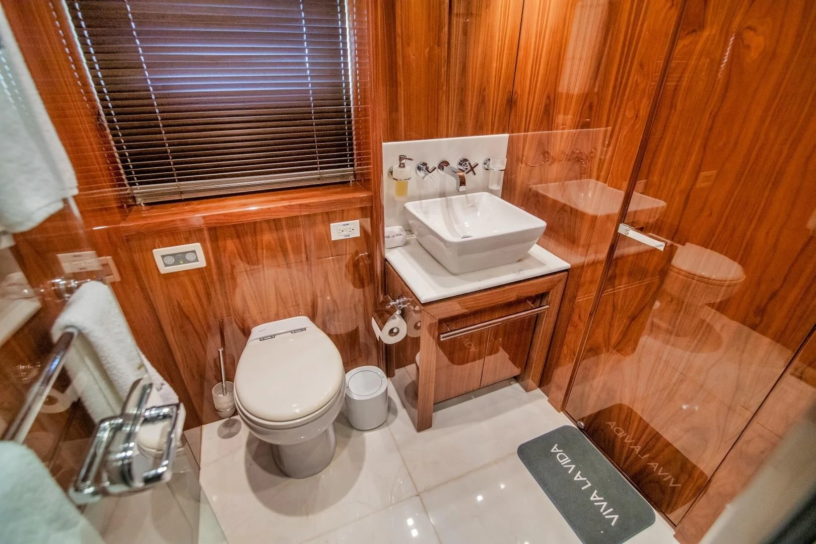 a bathroom with a toilet and sink aboard VIVA LA VIDA Yacht for Sale