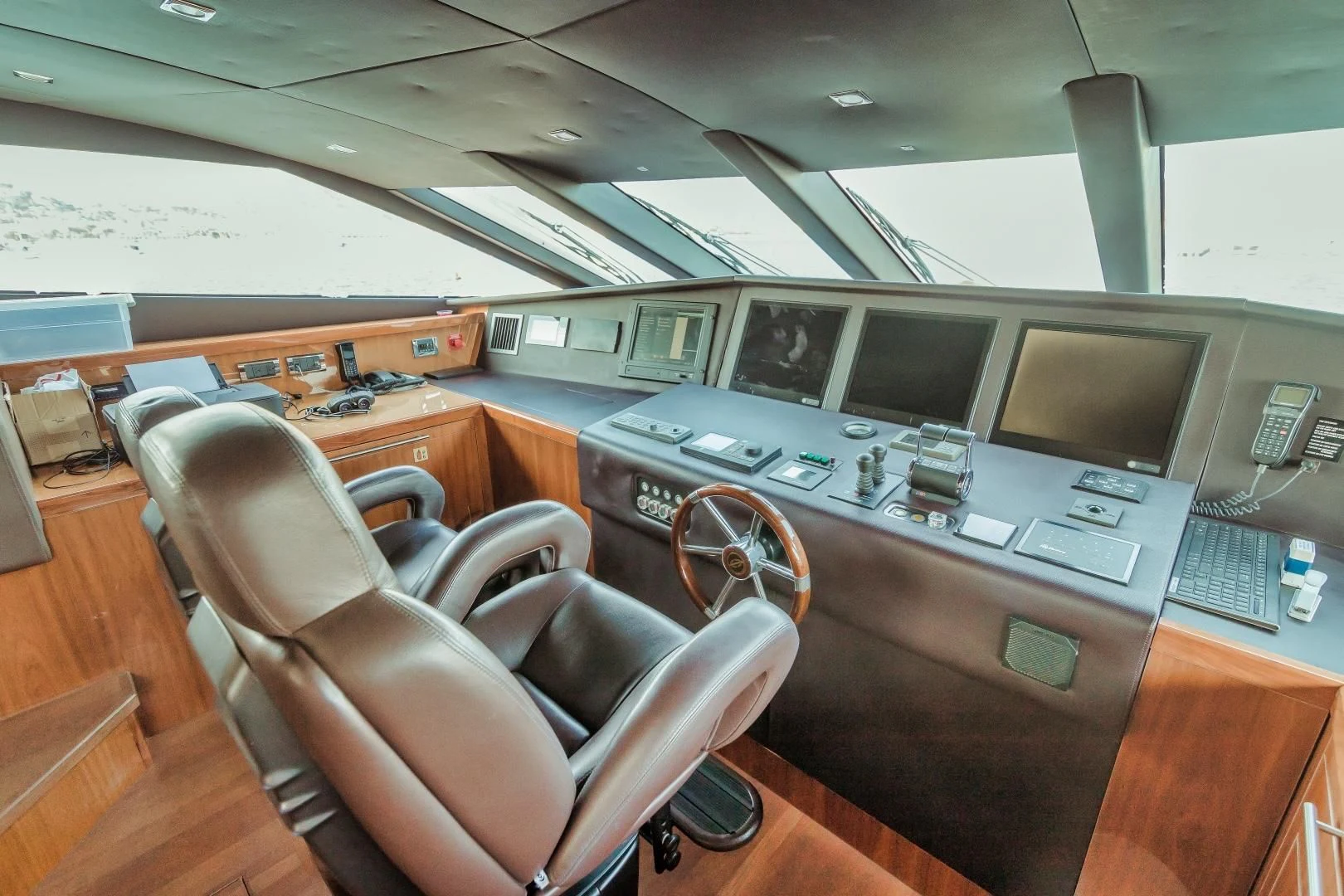 a room with computers and chairs aboard VIVA LA VIDA Yacht for Sale