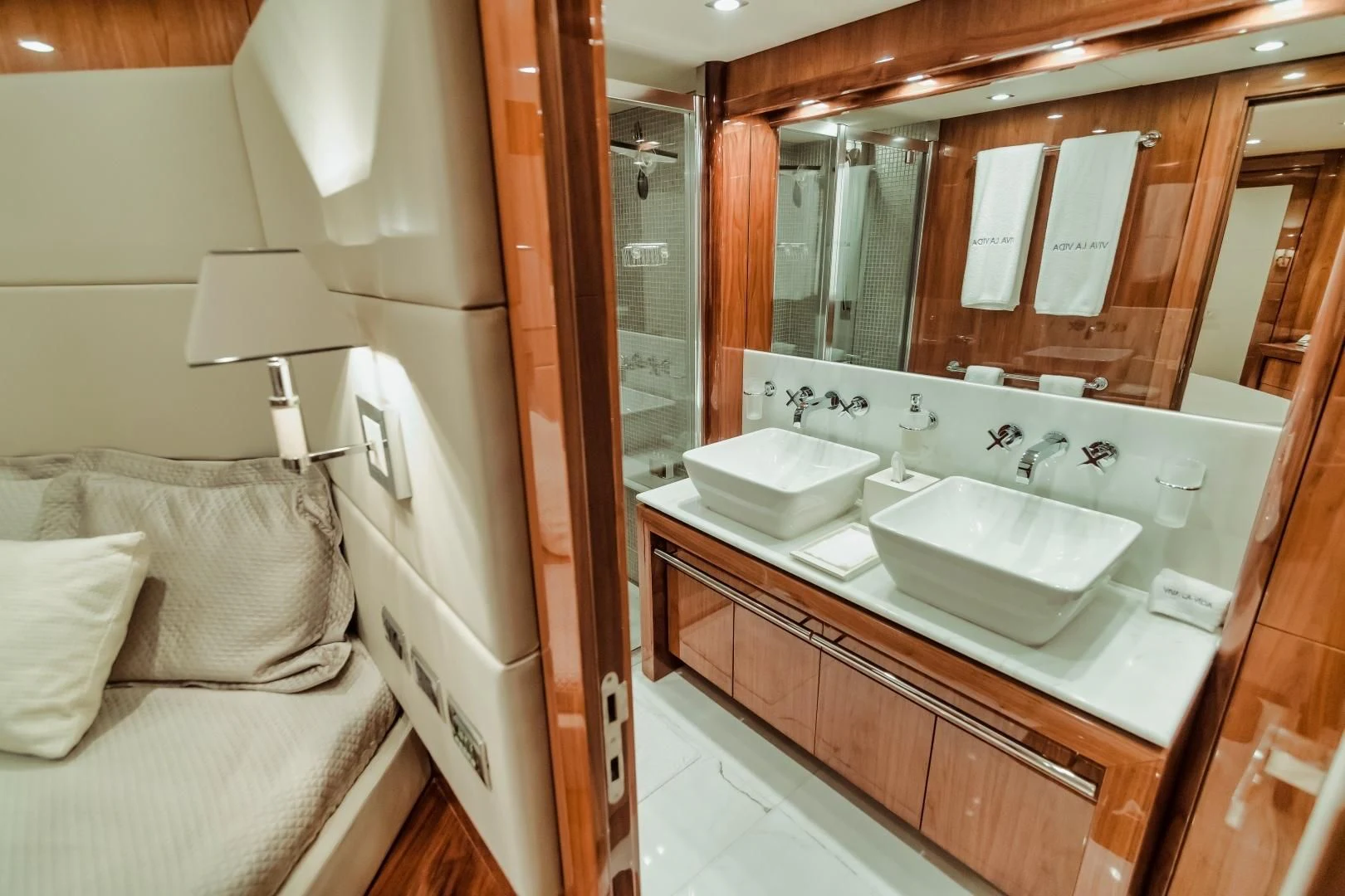 a bathroom with a large mirror aboard VIVA LA VIDA Yacht for Sale