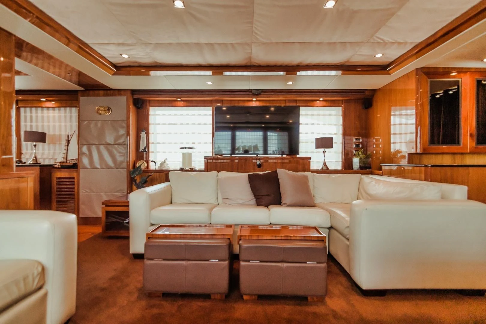 a living room with a couch and a table aboard VIVA LA VIDA Yacht for Sale