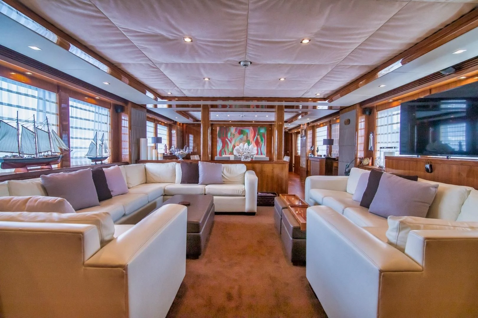 a living room with a large window aboard VIVA LA VIDA Yacht for Sale