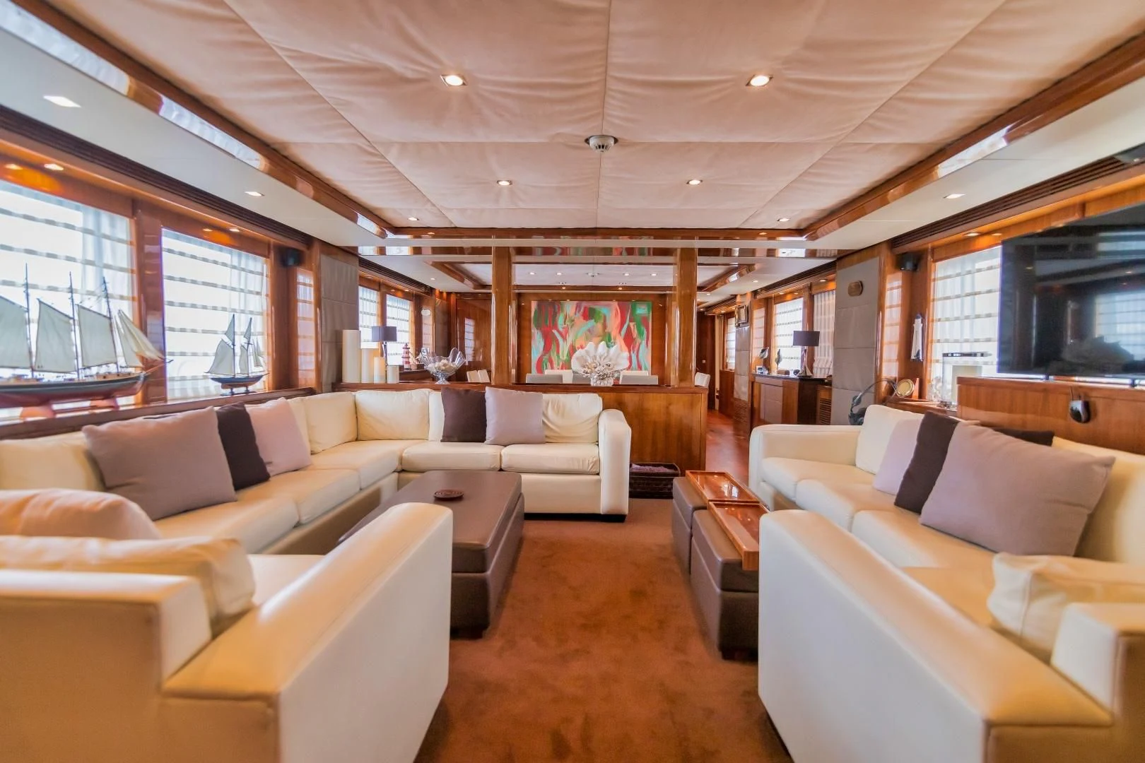 a living room with a large window aboard VIVA LA VIDA Yacht for Sale