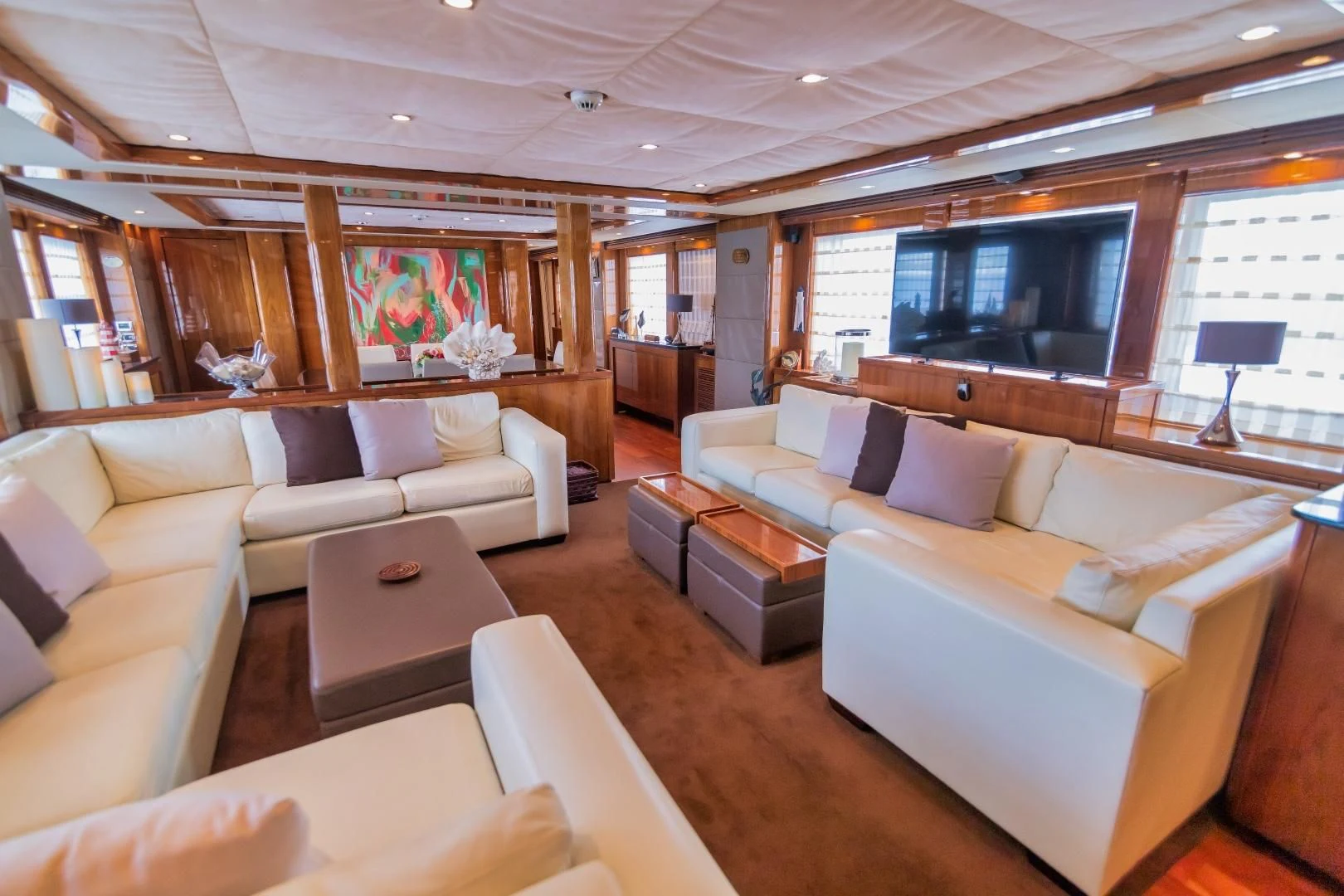 a living room with a large window aboard VIVA LA VIDA Yacht for Sale