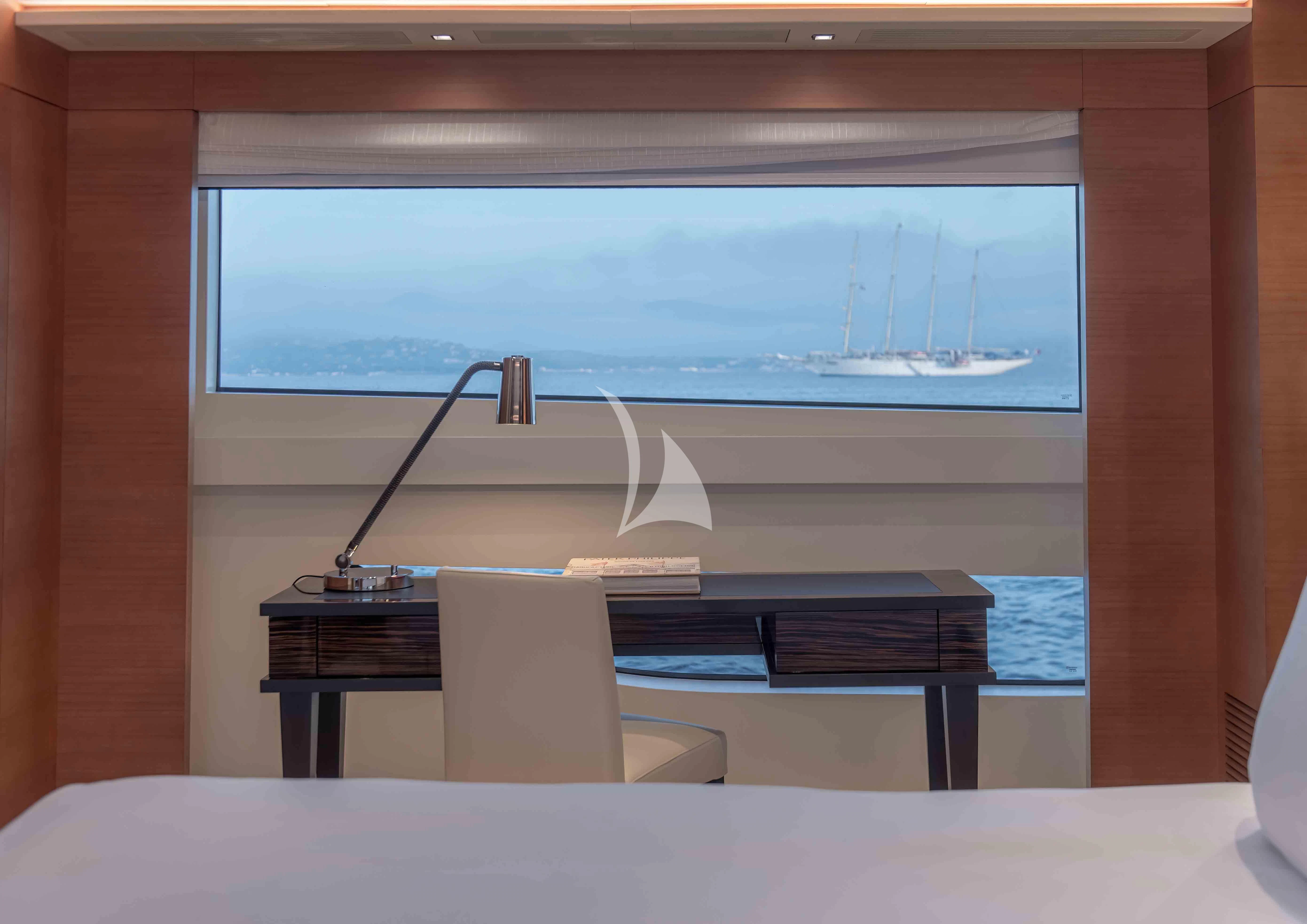 a room with a desk and a window aboard TONIC BLUE Yacht for Sale