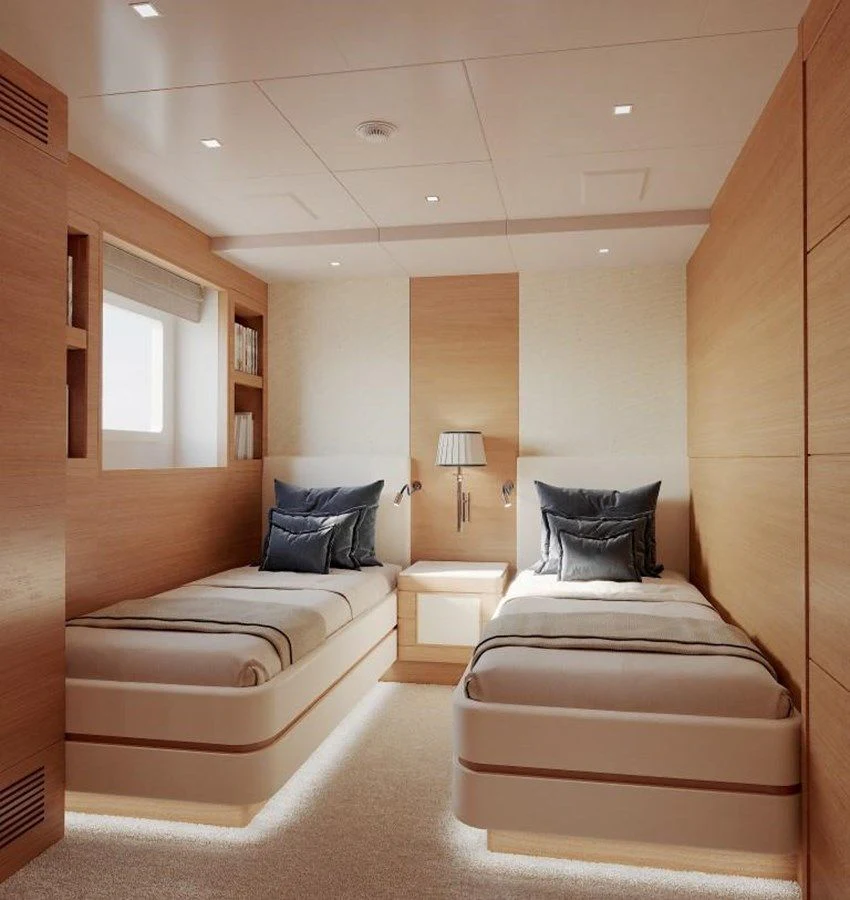 a room with a bed and a lamp aboard TONIC BLUE Yacht for Sale