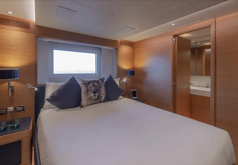 a bed with pillows aboard TONIC BLUE Yacht for Sale