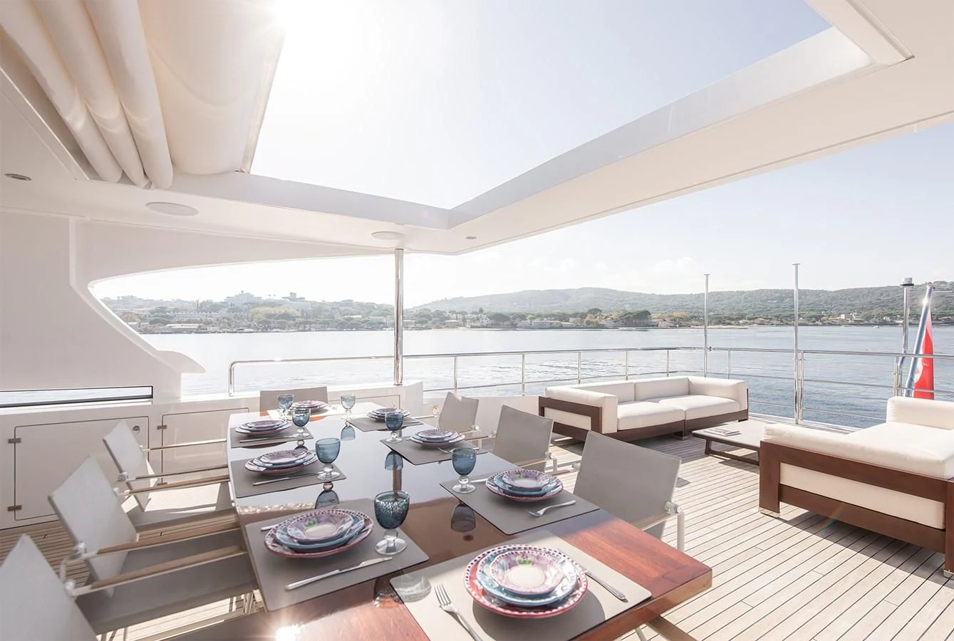 a large living room with a large balcony aboard TONIC BLUE Yacht for Sale