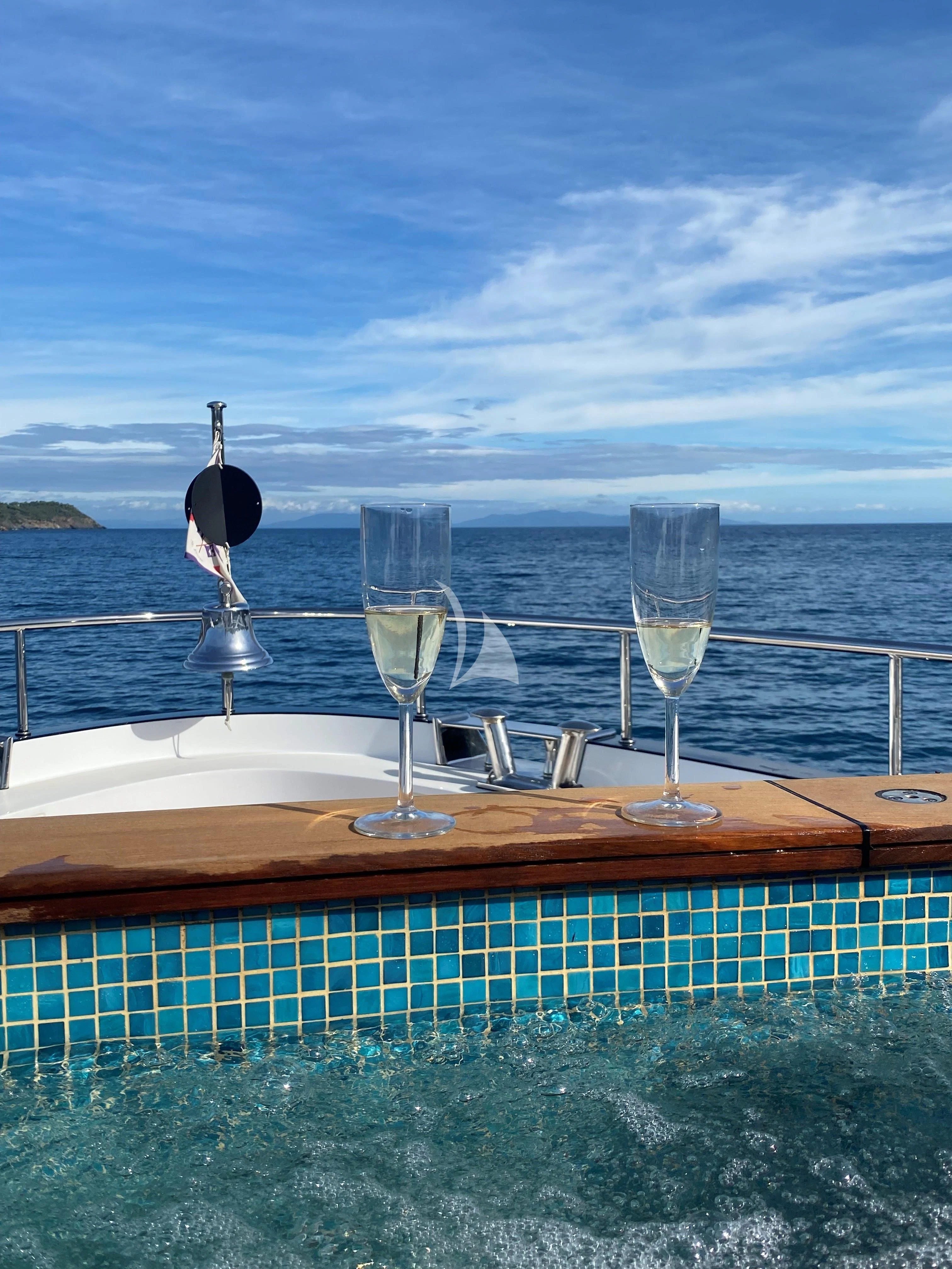 wine glasses on a table aboard TONIC BLUE Yacht for Sale
