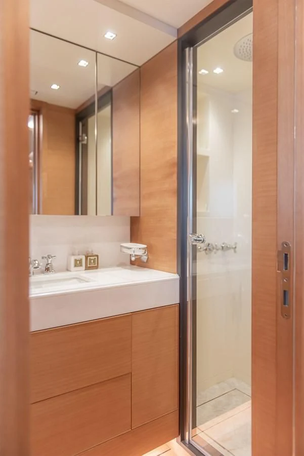 a bathroom with a large mirror aboard TONIC BLUE Yacht for Sale