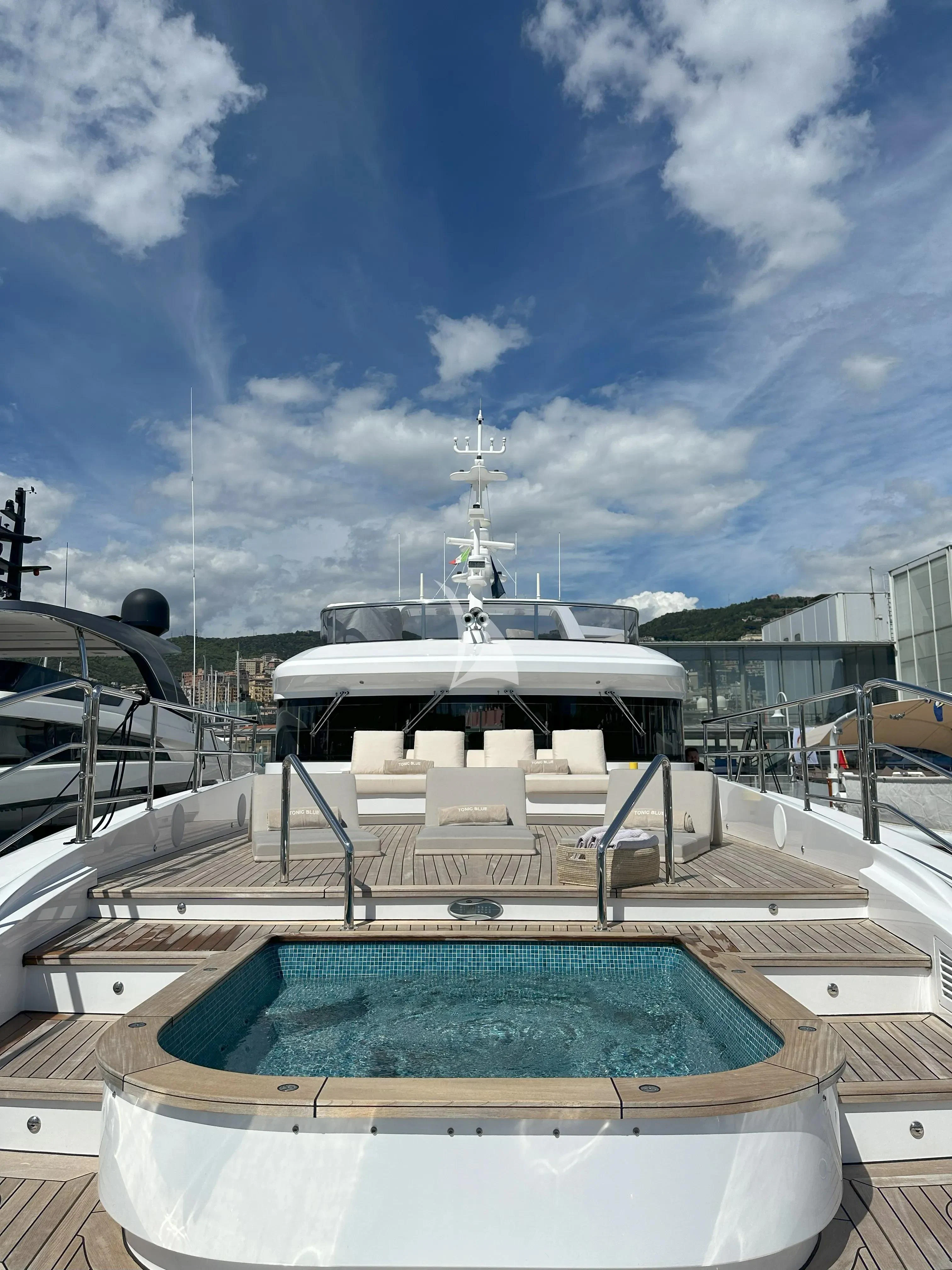 a boat docked at a pier aboard TONIC BLUE Yacht for Sale